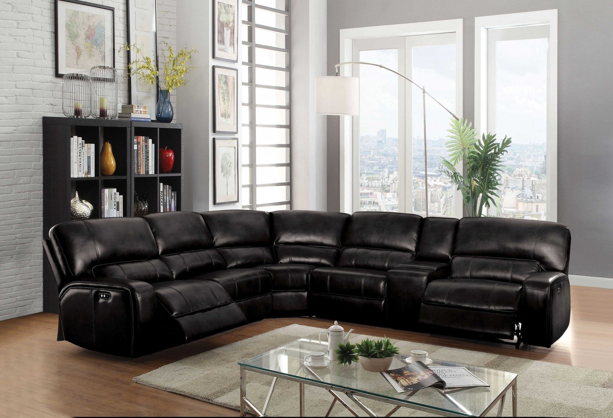 A luxurious black leather-aire motion sofa with plush cushions and USB docks on both sides, designed for modern living rooms.
