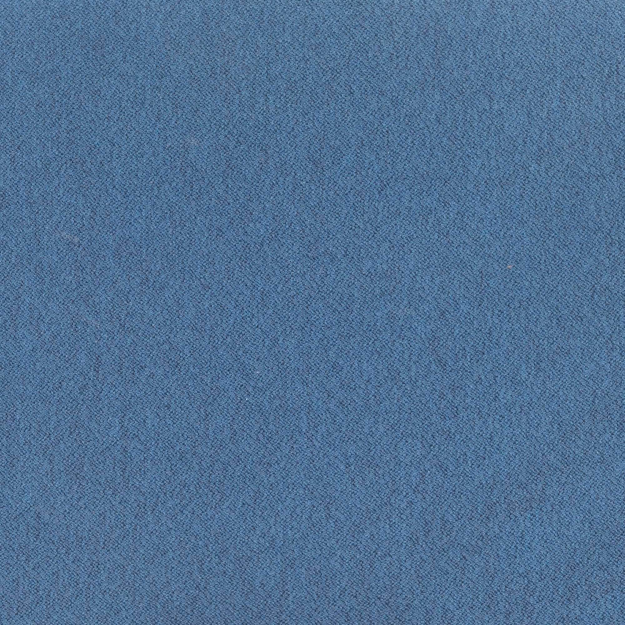 A stylish petite stool featuring an upholstered round seat in ink blue poly linen and a walnut wood base, perfect for home or office use.