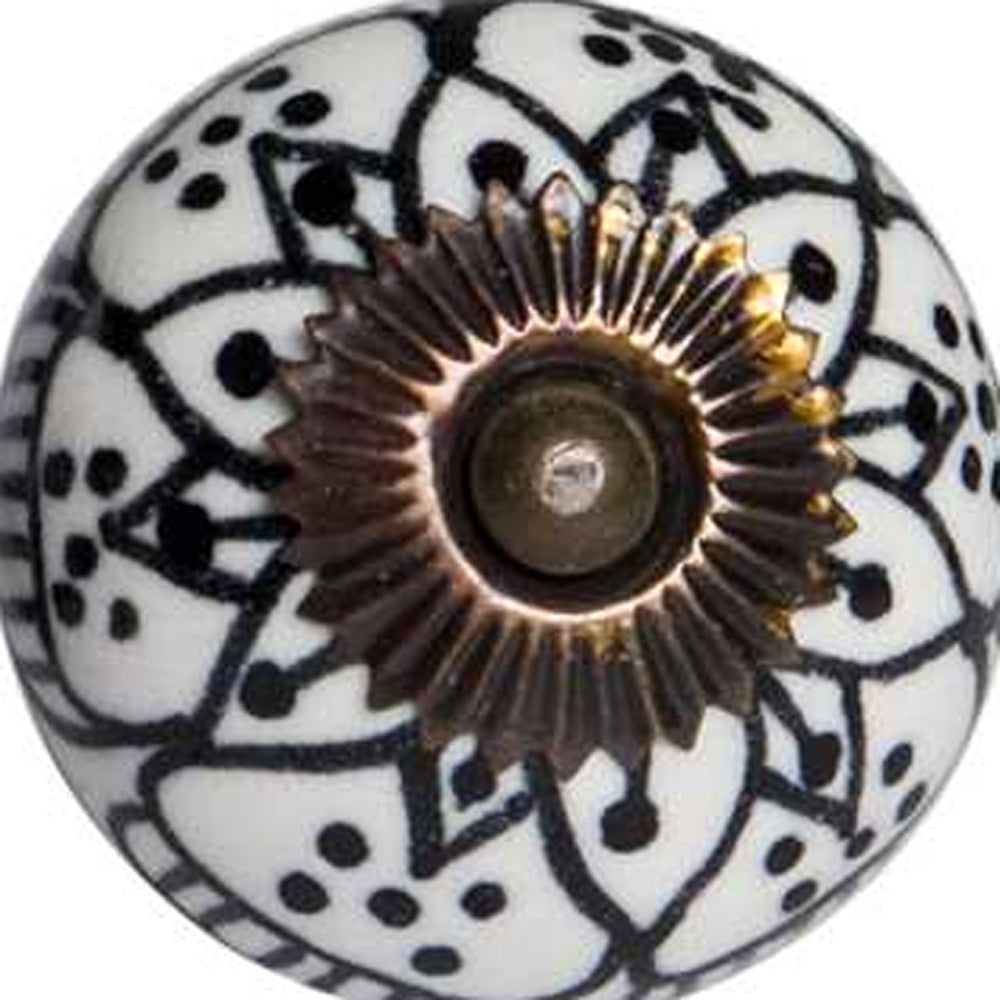 A pack of 12 black, white, and copper ceramic knobs, each measuring 1.5 inches, showcasing a hand-painted floral design.