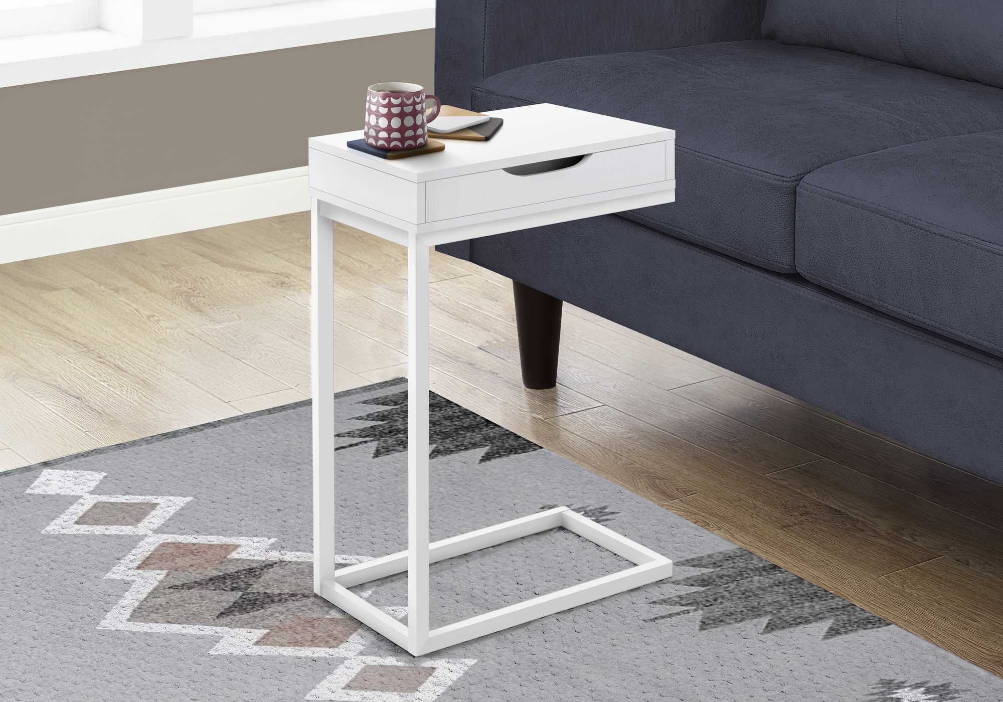 A stylish white metal accent table with a drawer, featuring a C-shaped design for easy placement beside a sofa or bed.