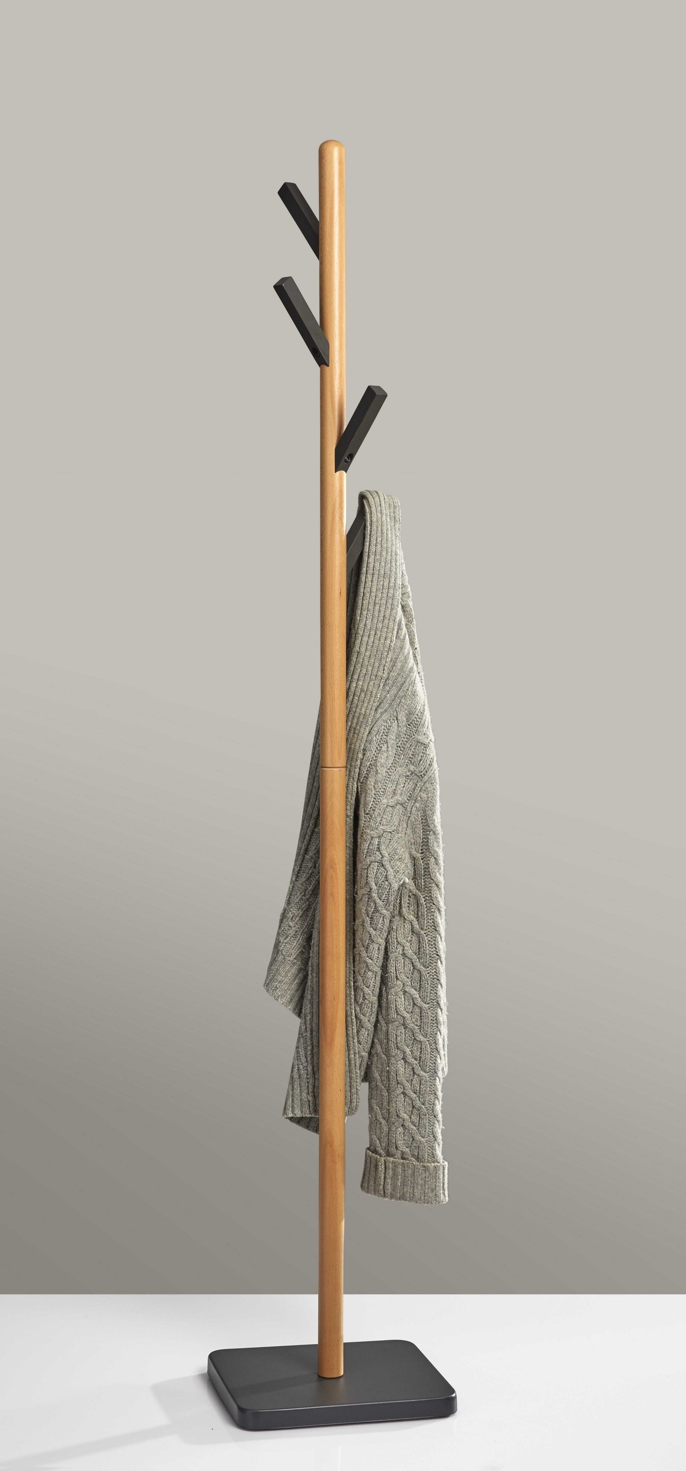 A stylish 11.75" X 9.75" X 66.5" natural coat rack made of beech wood with grey rubber wood hooks and a sturdy grey metal base.