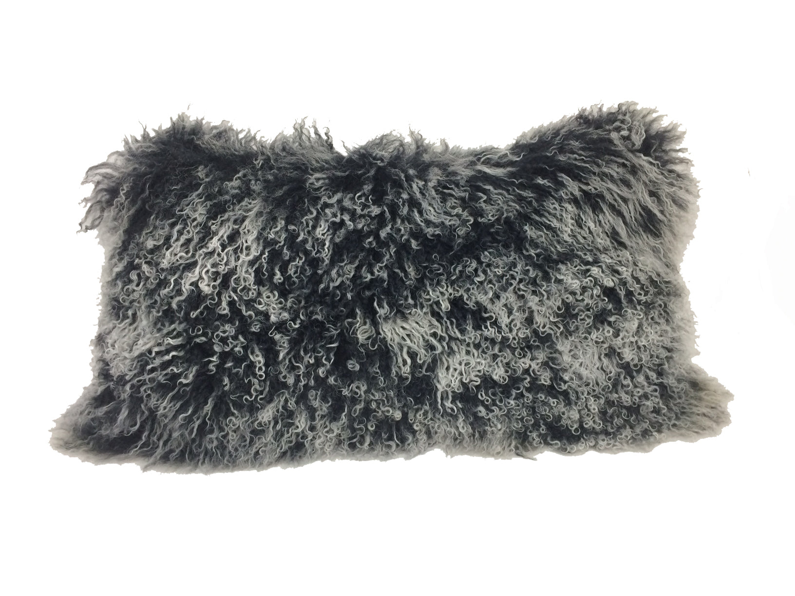 A luxurious 17-inch black genuine Tibetan lamb fur pillow with a soft microsuede backing, elegantly displayed on a sofa.