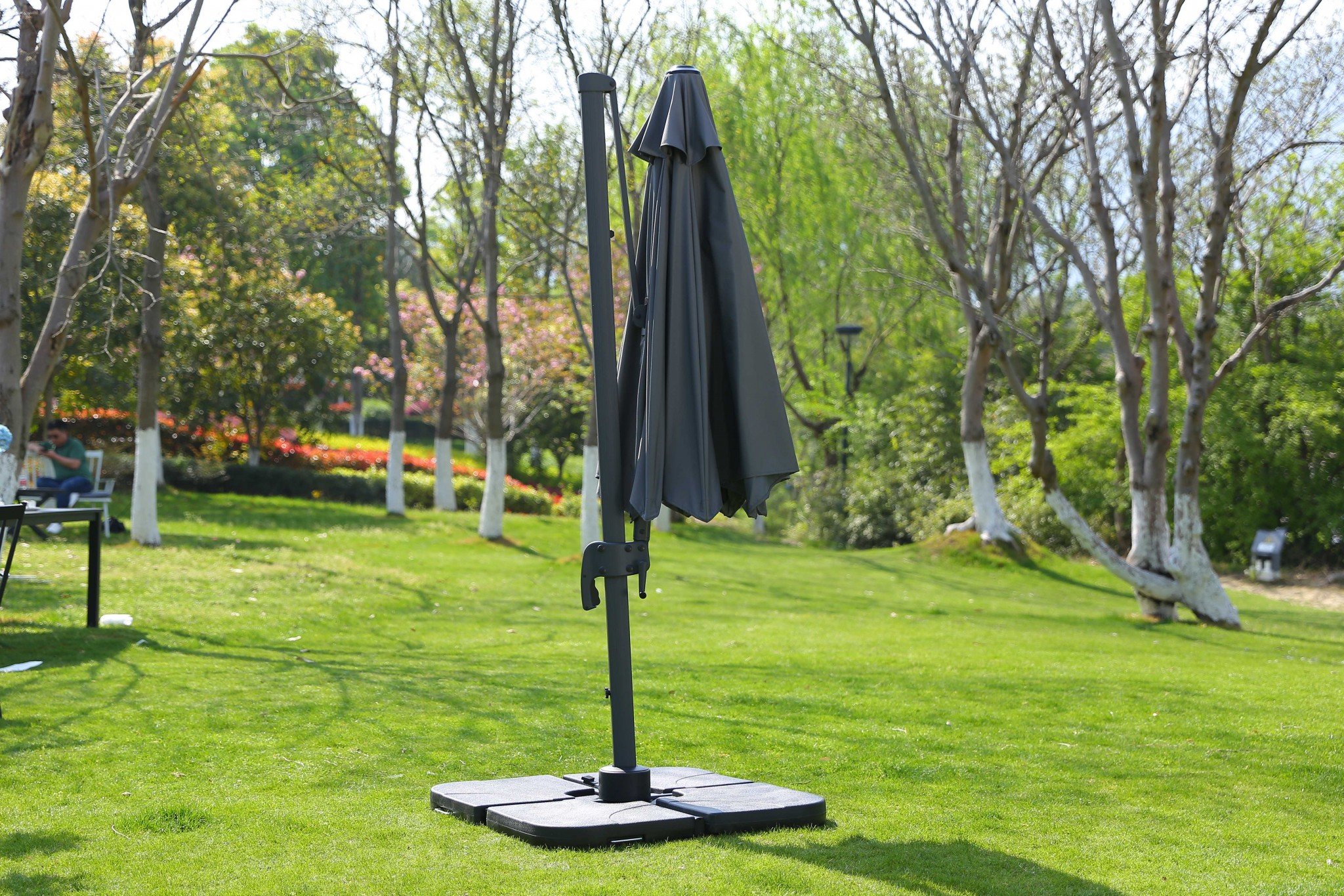 A stylish 118" X 118" X 97" gray steel standing umbrella, showcasing contemporary design and high-grade iron construction.