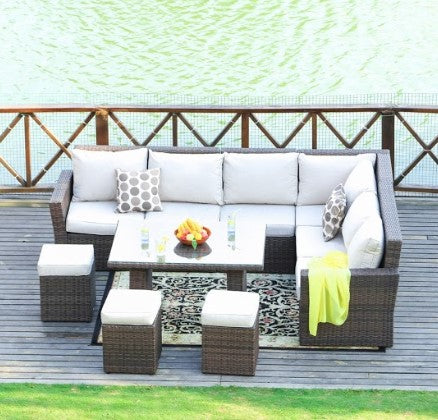 Brown 8-piece outdoor sectional sofa set featuring two side sofas, one corner sofa, one middle sofa, a table with tempered glass, and three ottomans.