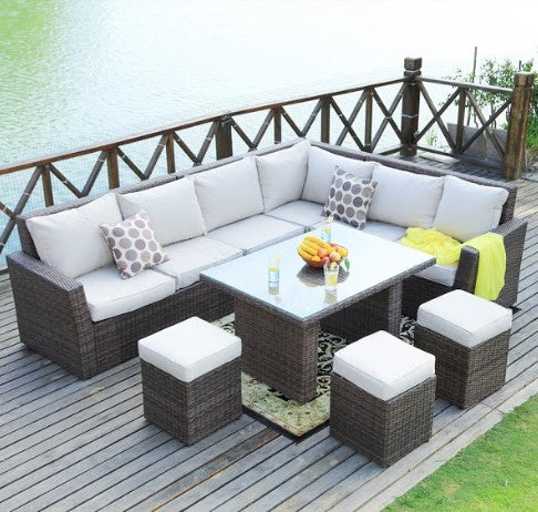 Brown 8-piece outdoor sectional sofa set featuring two side sofas, one corner sofa, one middle sofa, a table with tempered glass, and three ottomans.