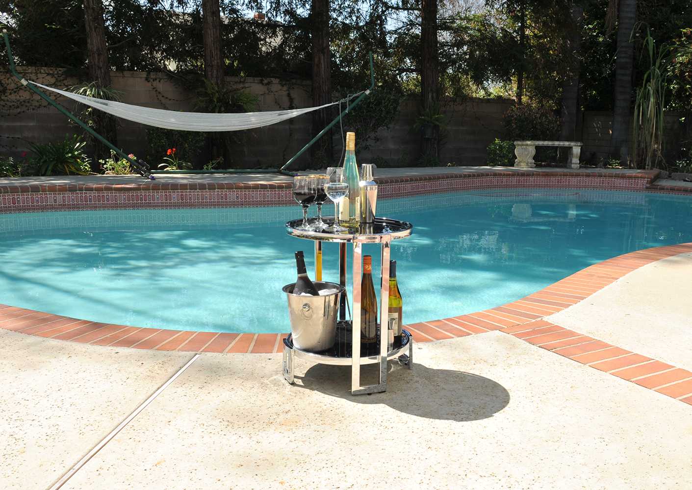 A stylish chrome round end table featuring a sleek chrome frame and black tempered glass top, perfect for modern home decor.
