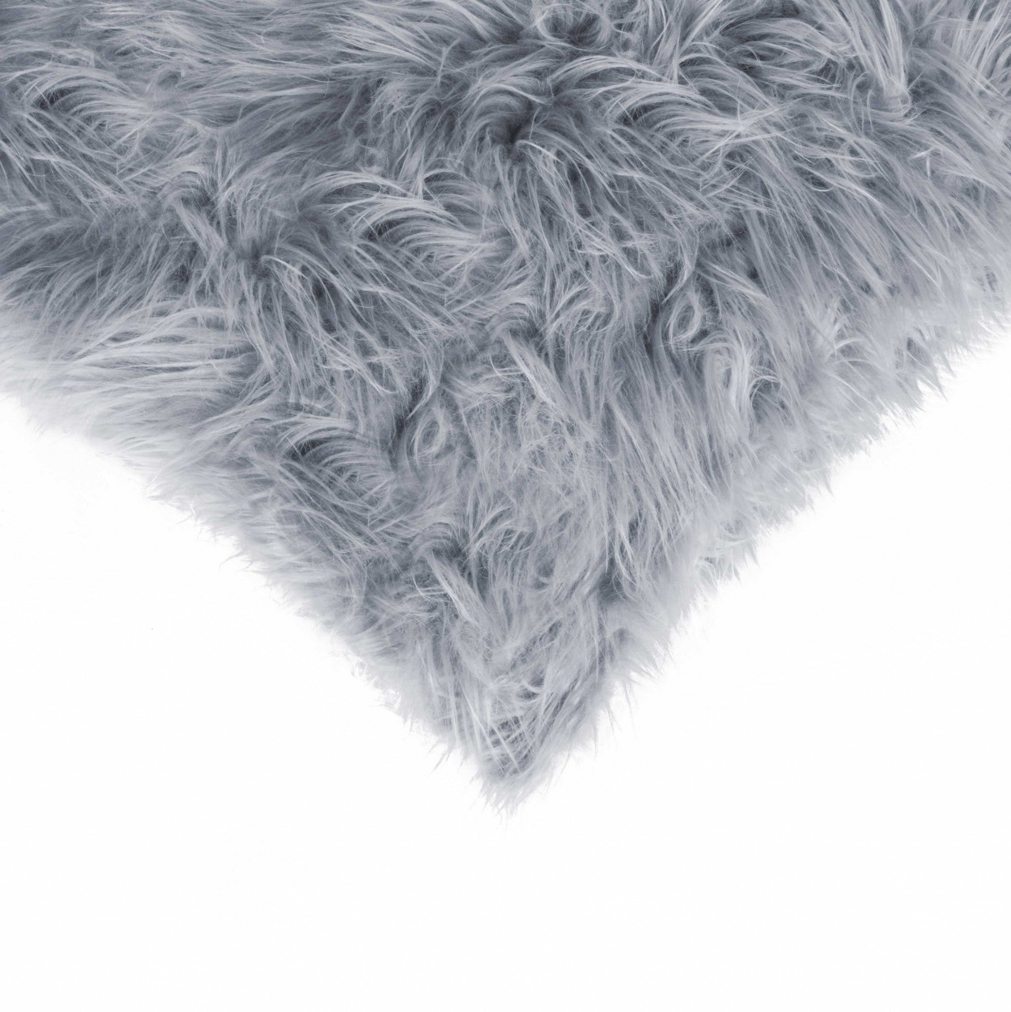 Two luxurious grey faux fur pillows, 18x18 inches, showcasing a soft and plush texture, perfect for home decor.