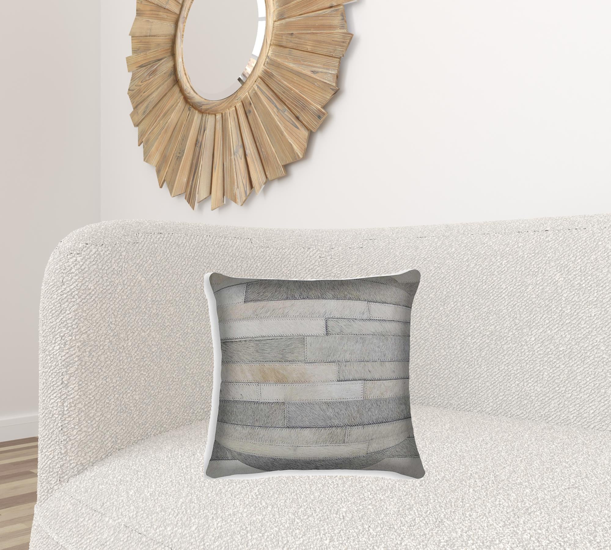 18x18 natural cowhide pillow with soft microsuede backing and hidden zipper closure, showcasing unique shades and textures.
