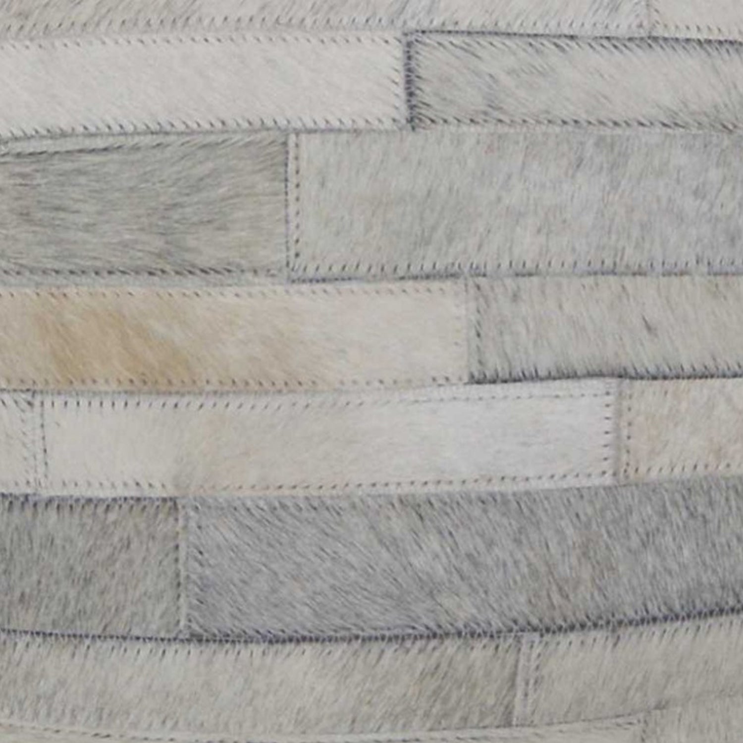 18x18 natural cowhide pillow with soft microsuede backing and hidden zipper closure, showcasing unique shades and textures.