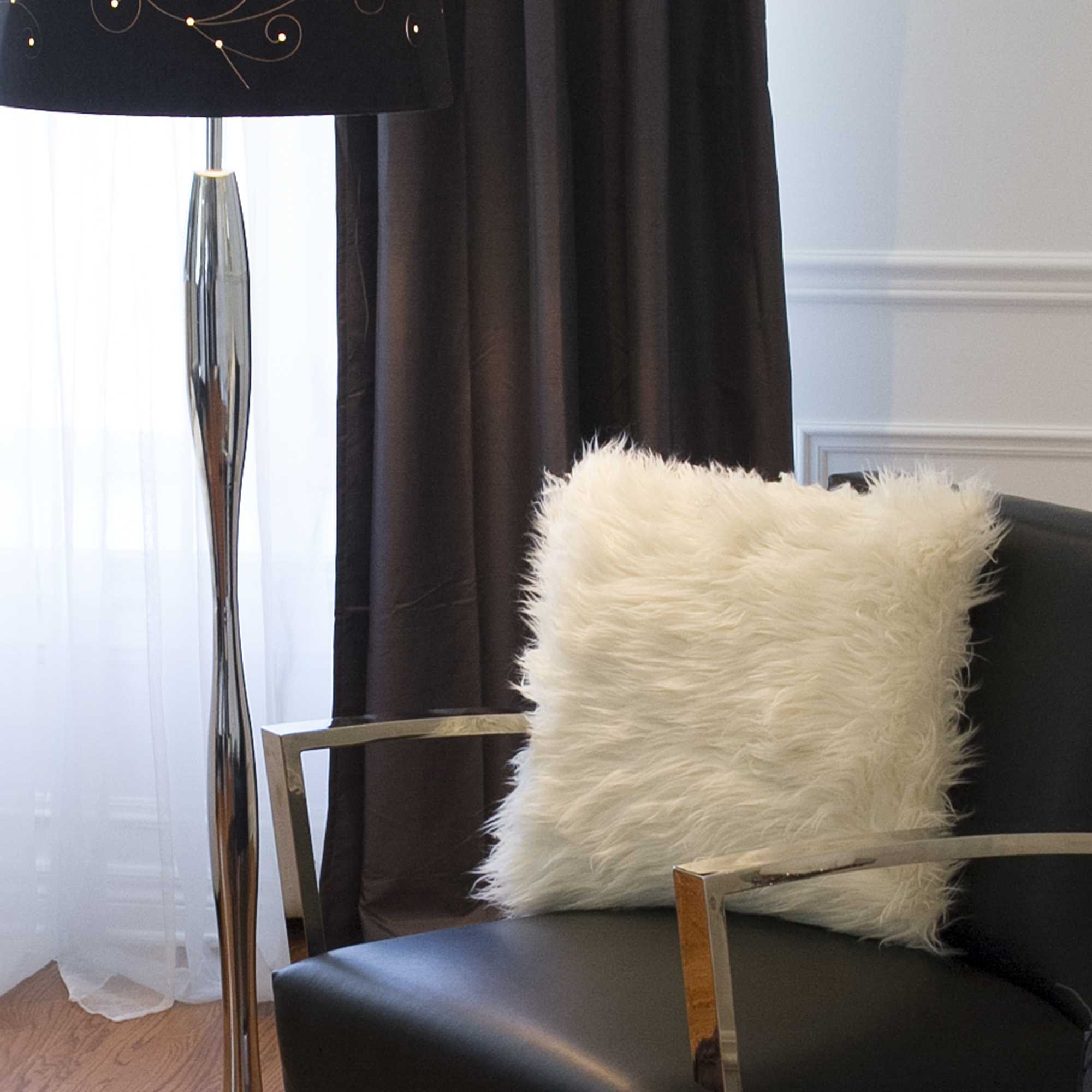 Two luxurious off white faux fur pillows, 18x18 inches, showcasing a plush texture and elegant design, perfect for home decor.