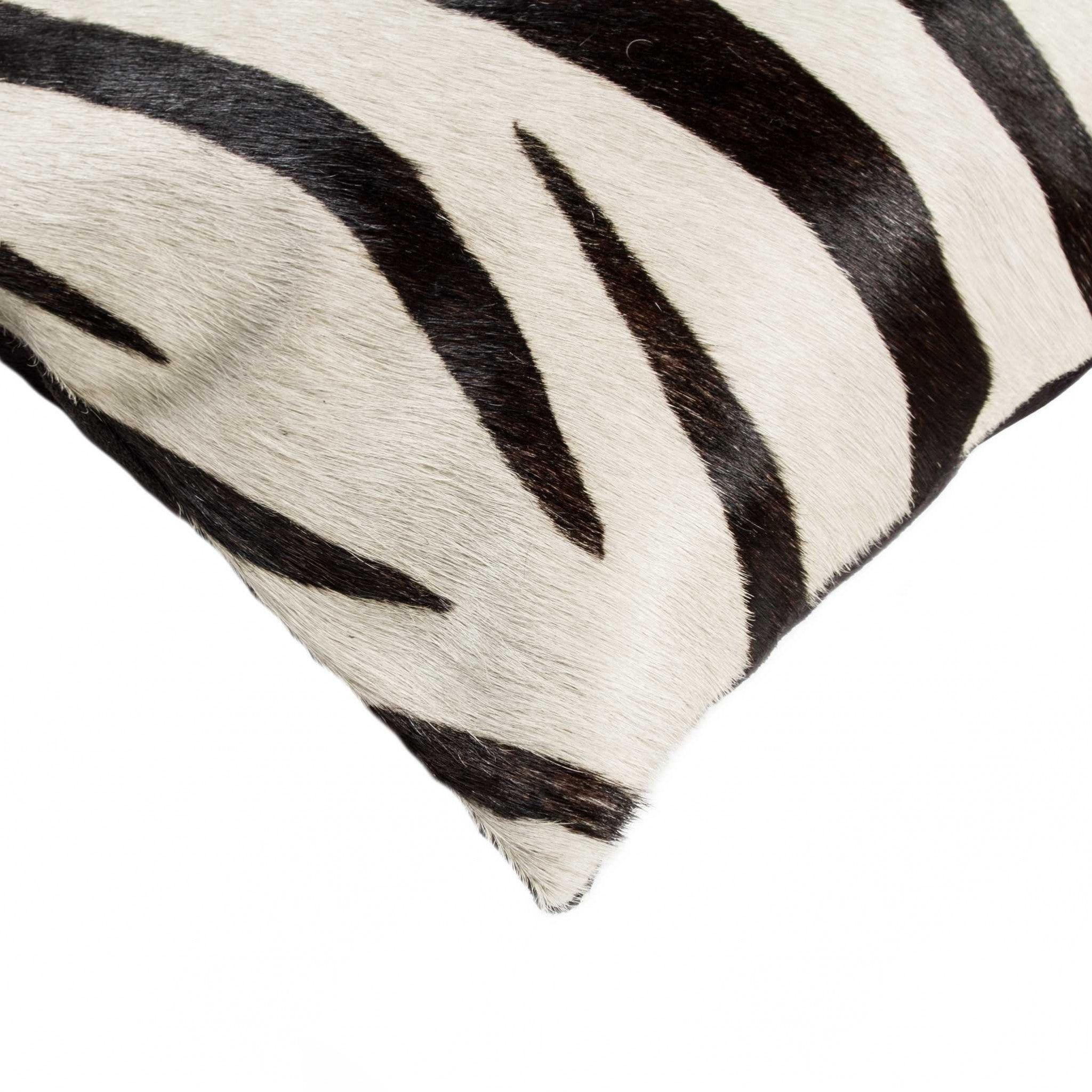Luxurious 18x18 Zebra Black On Off White Cowhide Pillow with hidden zipper and soft microsuede backing, showcasing unique mottling.