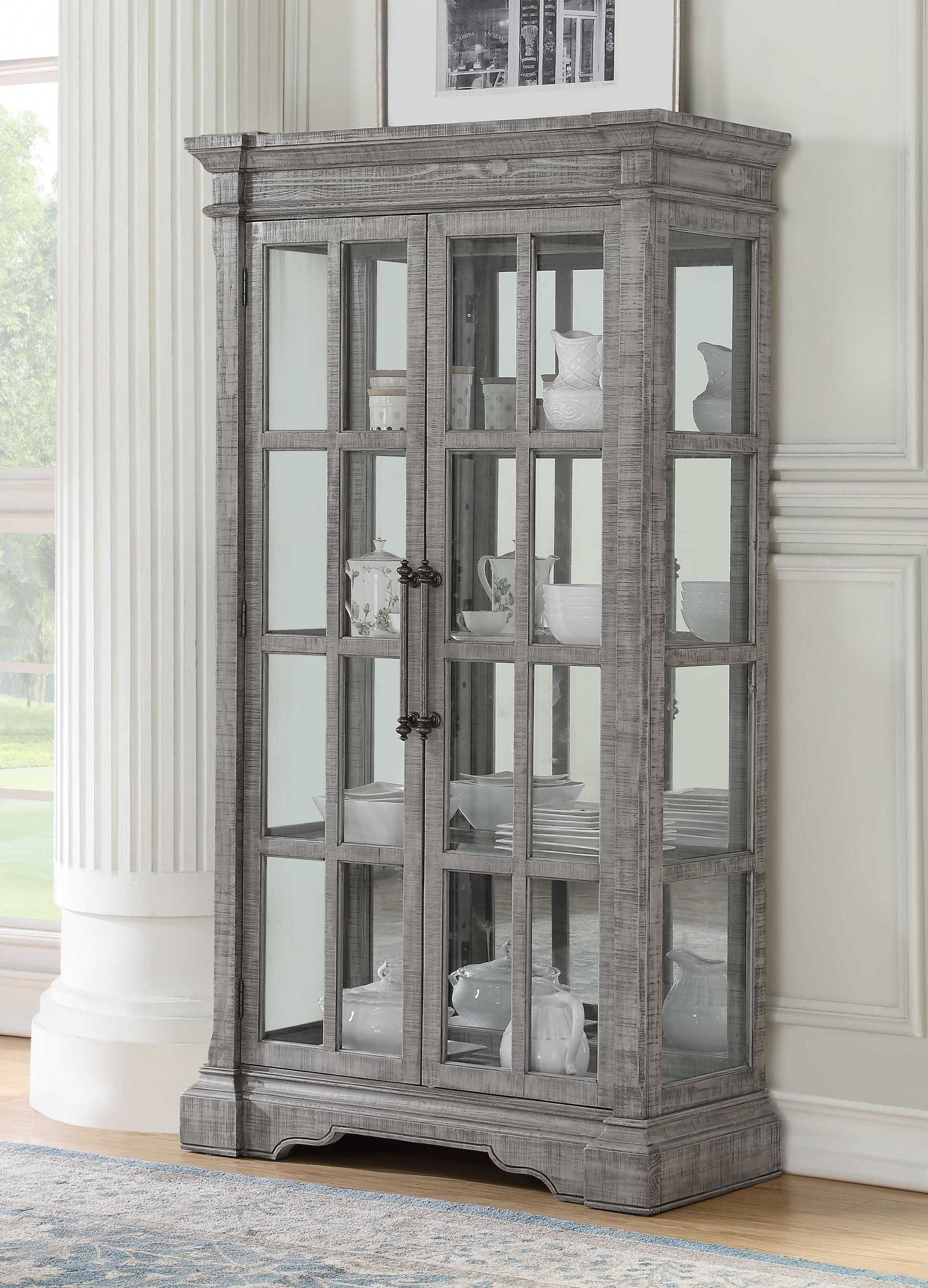 Elegant salvaged natural wood glass curio cabinet with three shelves and scrolled motifs, perfect for displaying collectibles.