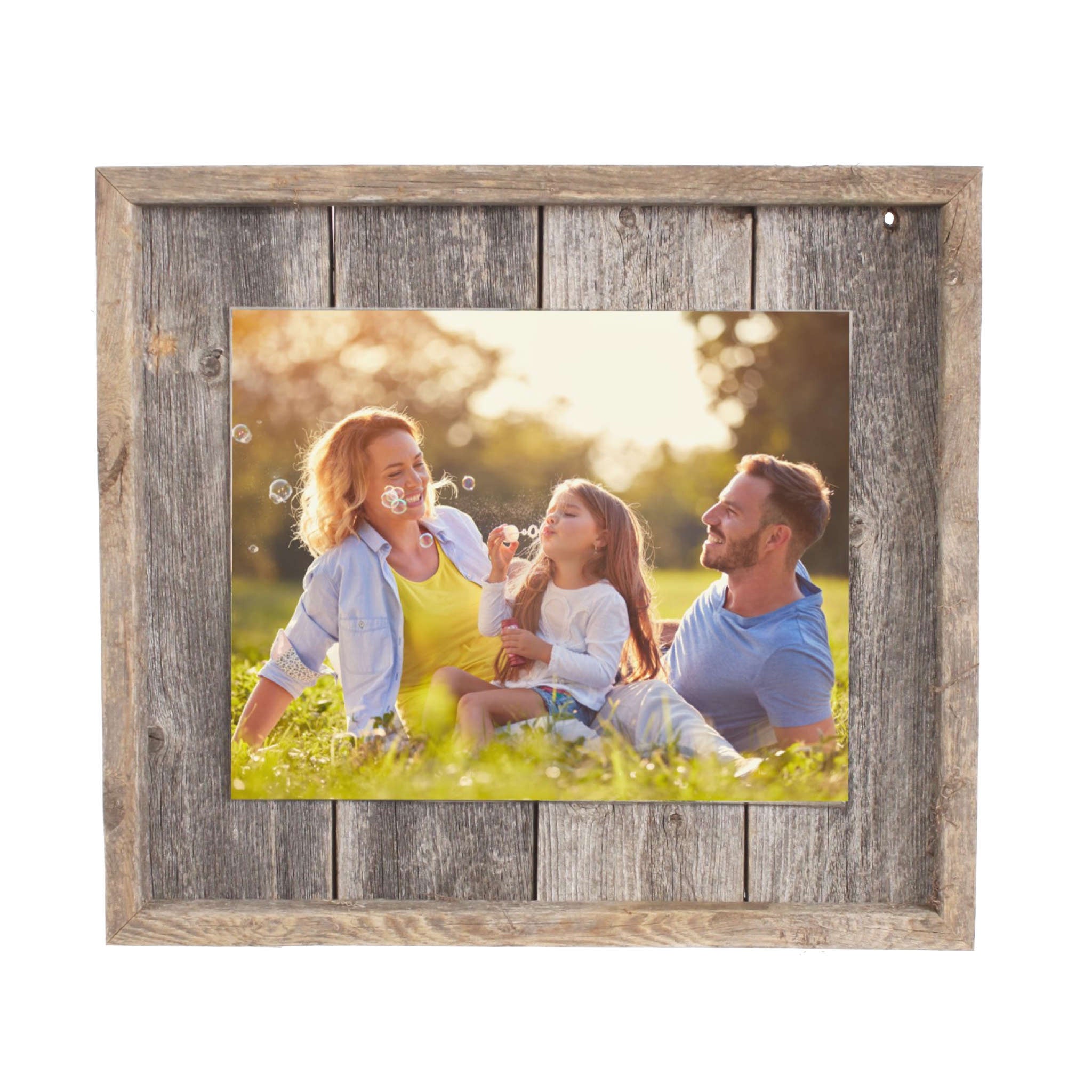 Rustic weathered gray picture frame holding an 11x14 photo, made from reclaimed wood with plexiglass protection.