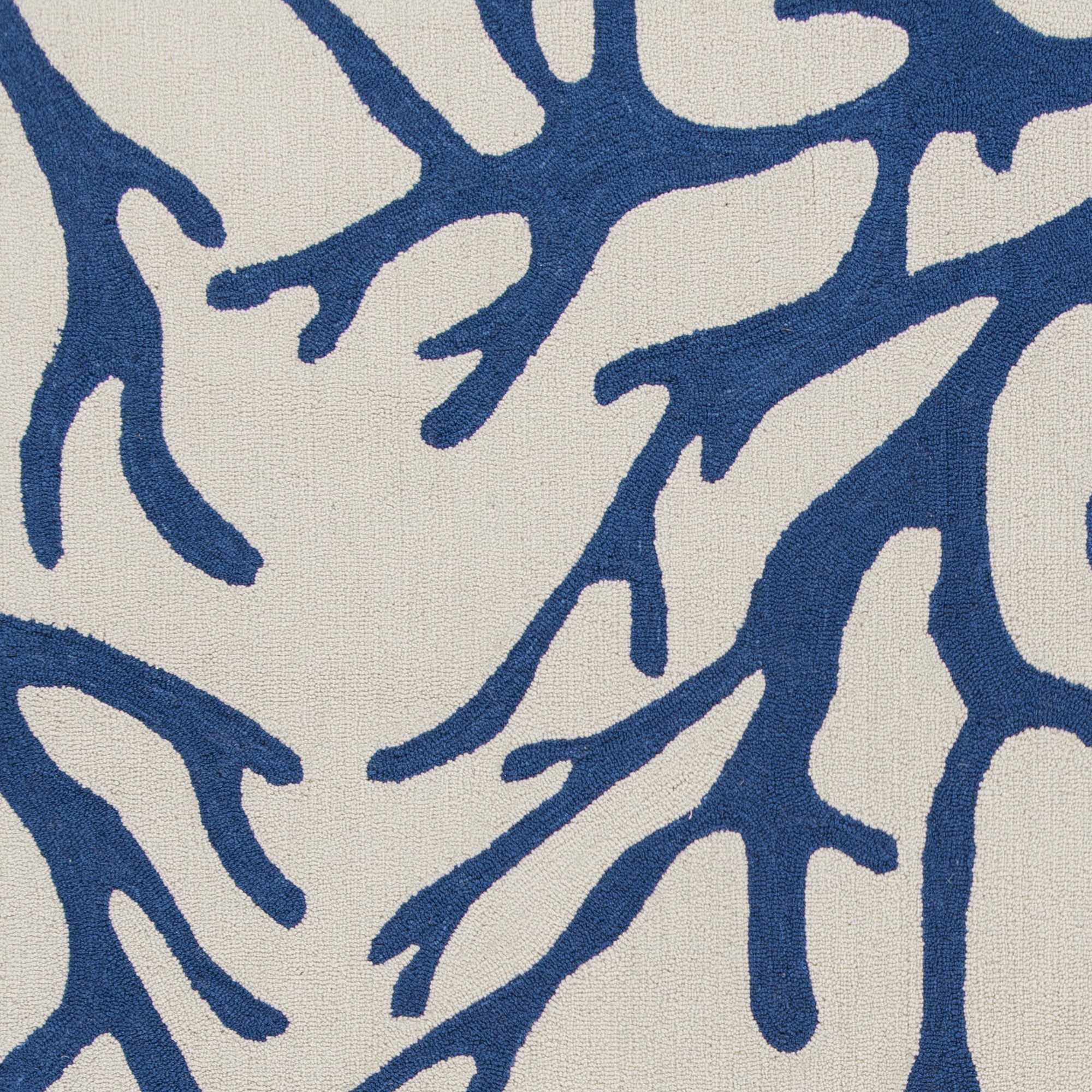 A stylish 2' x 4' area rug in ivory and blue, featuring a hand-hooked design, perfect for contemporary home decor.
