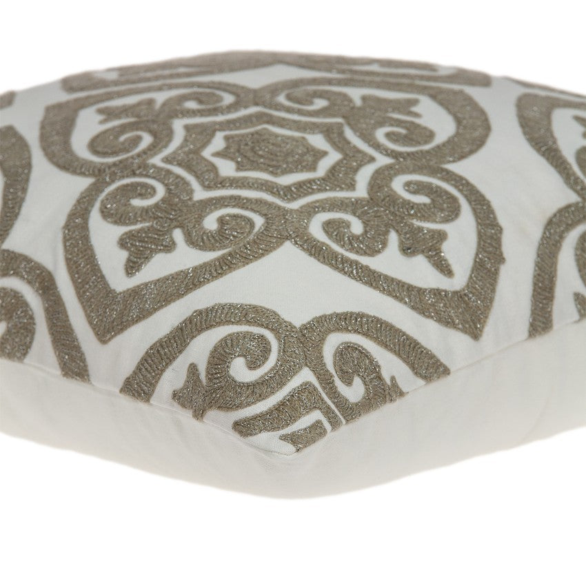 A luxurious 20x7x20 bling ivory pillow cover made from soft cotton fabric, featuring a poly insert for comfort, elegantly displayed on a sofa.