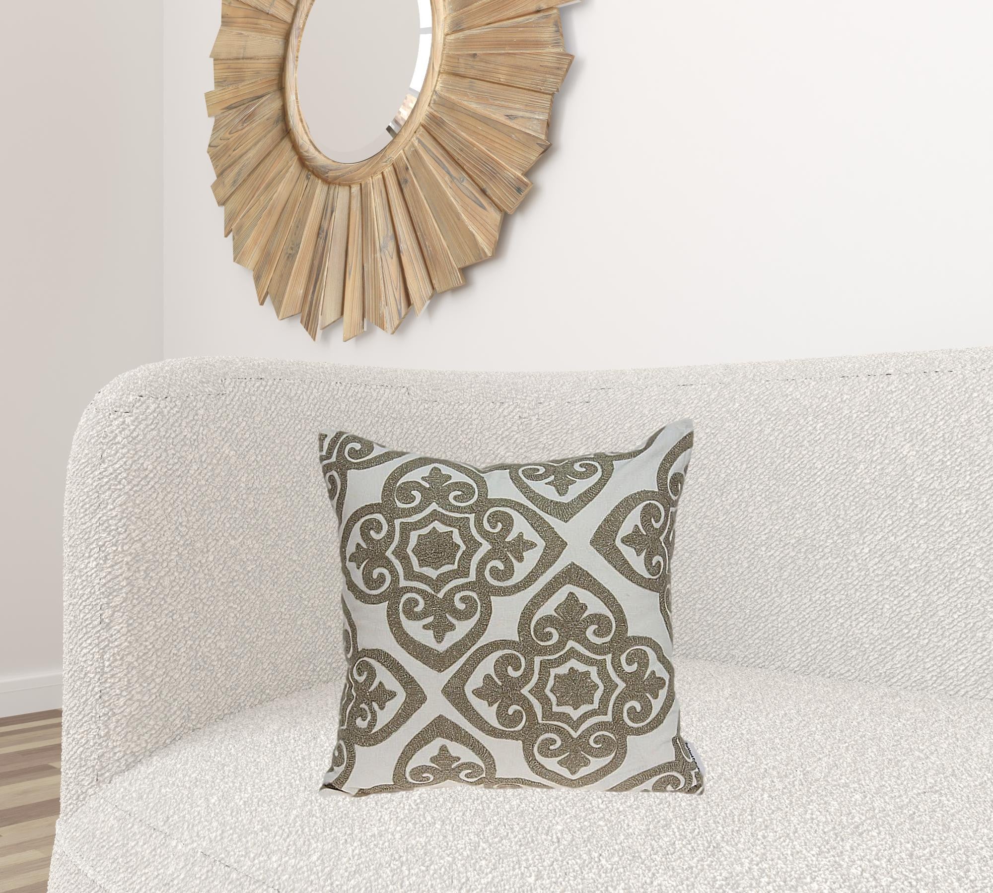 A luxurious 20x7x20 bling ivory pillow cover made from soft cotton fabric, featuring a poly insert for comfort, elegantly displayed on a sofa.