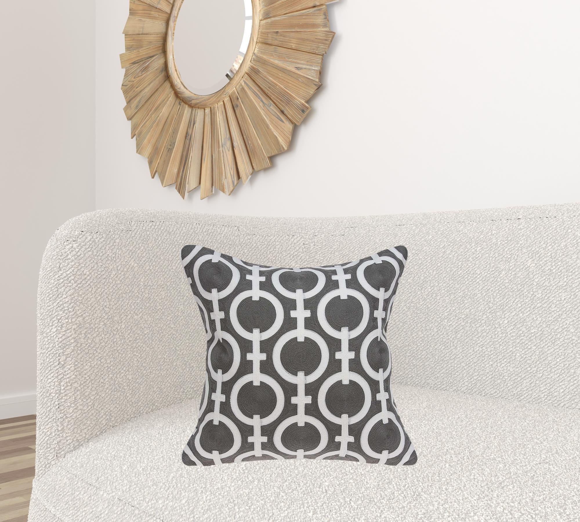 Transitional gray and white accent pillow measuring 20x7x20 inches, featuring a geometric pattern and soft cotton fabric.