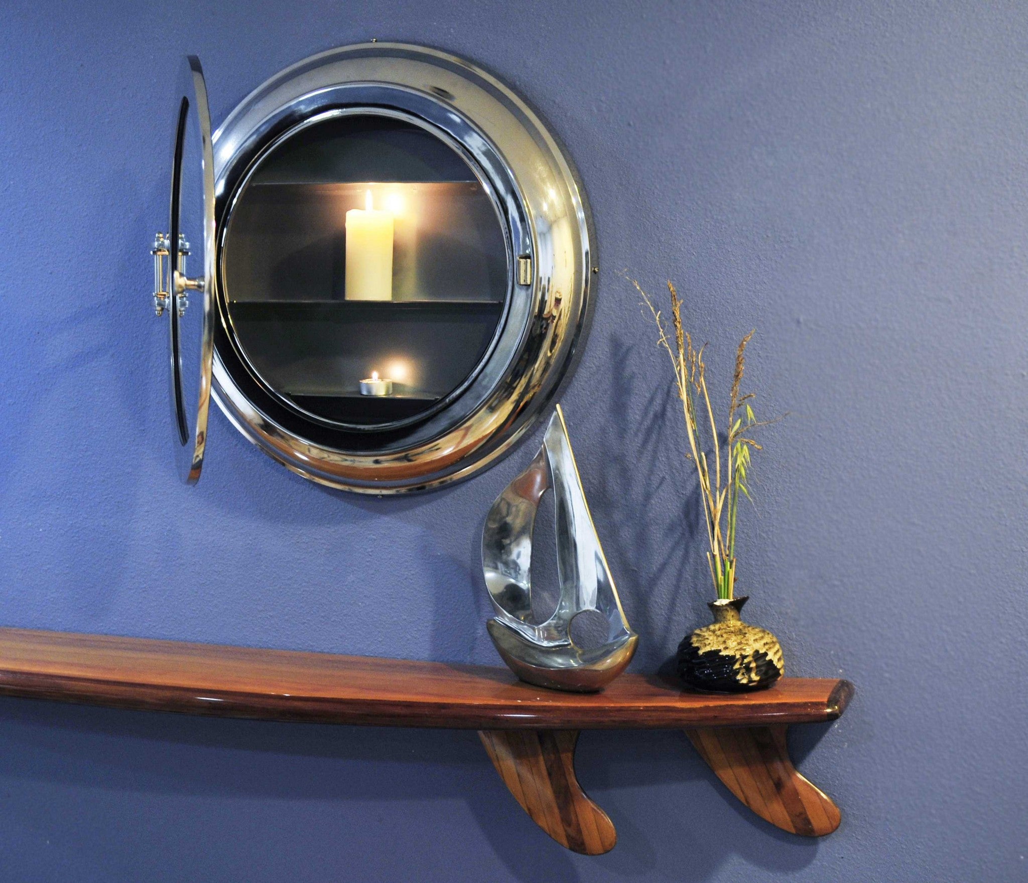 A stylish 21x21 inches aluminum wall mirror with a vintage porthole design, featuring a hinged storage compartment and a sleek nickel finish.