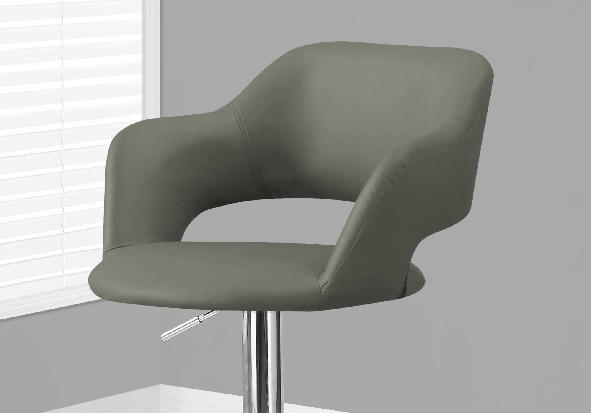 Stylish light grey foam metal leather look bar chair with chrome base, perfect for modern dining spaces.