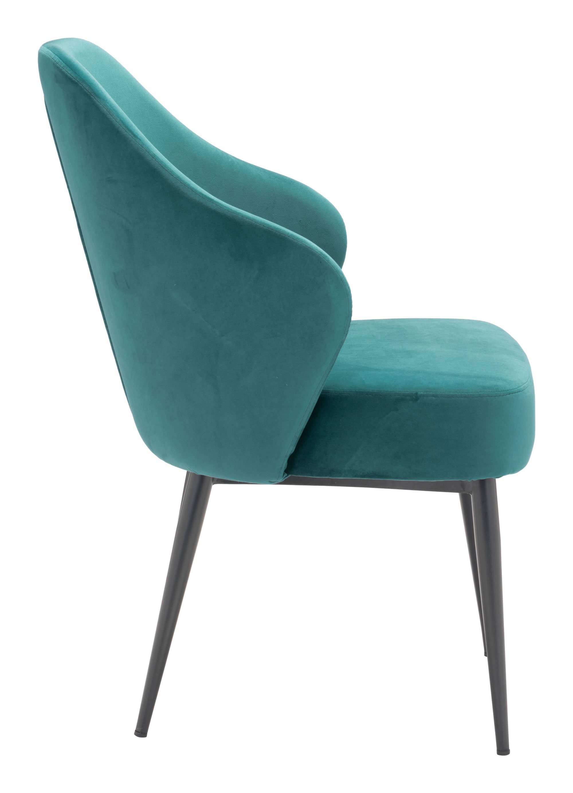 A luxurious green velvet dining chair with a modified wingback design and tapered pencil legs, perfect for modern dining rooms.