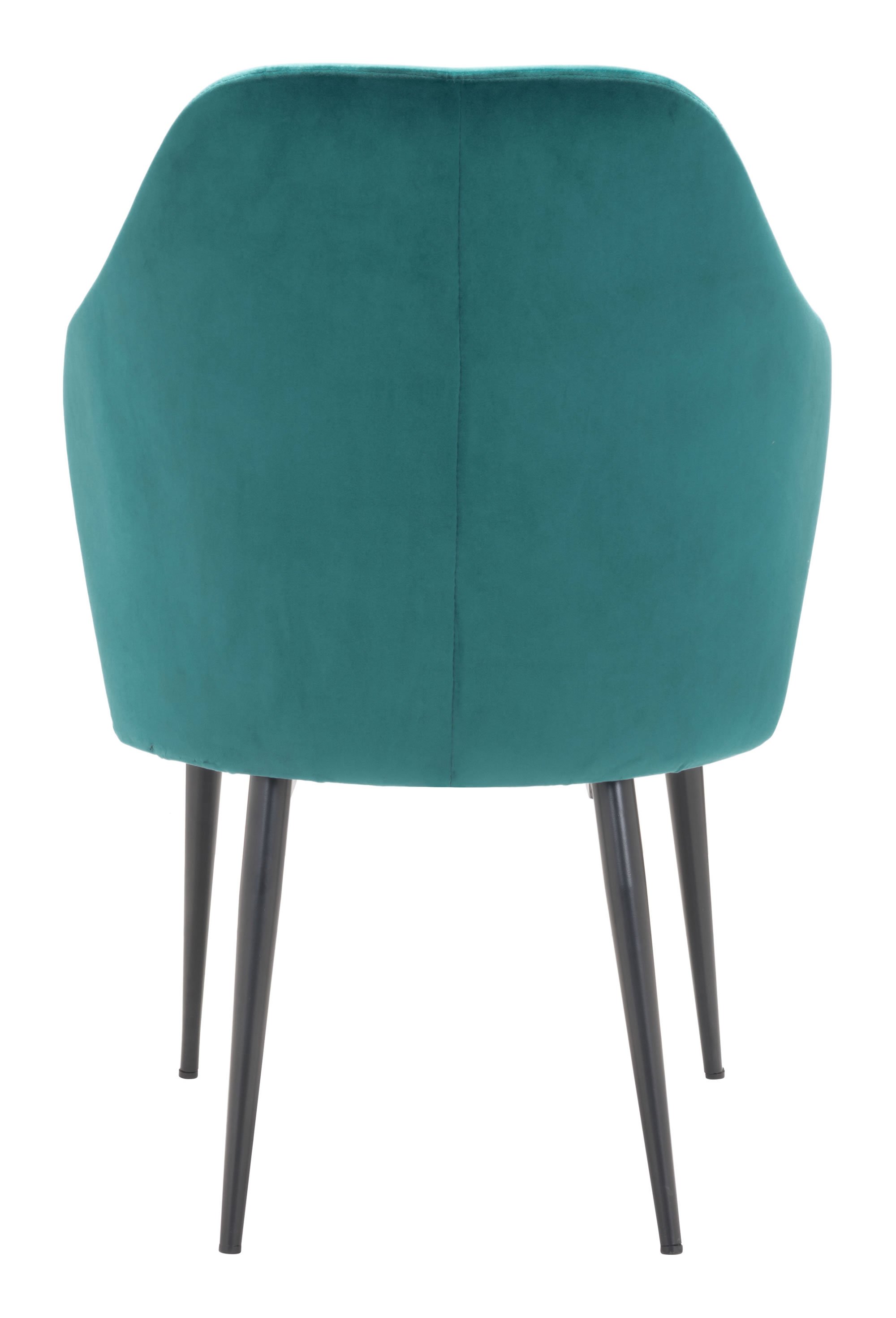 A luxurious green velvet dining chair with a modified wingback design and tapered pencil legs, perfect for modern dining rooms.
