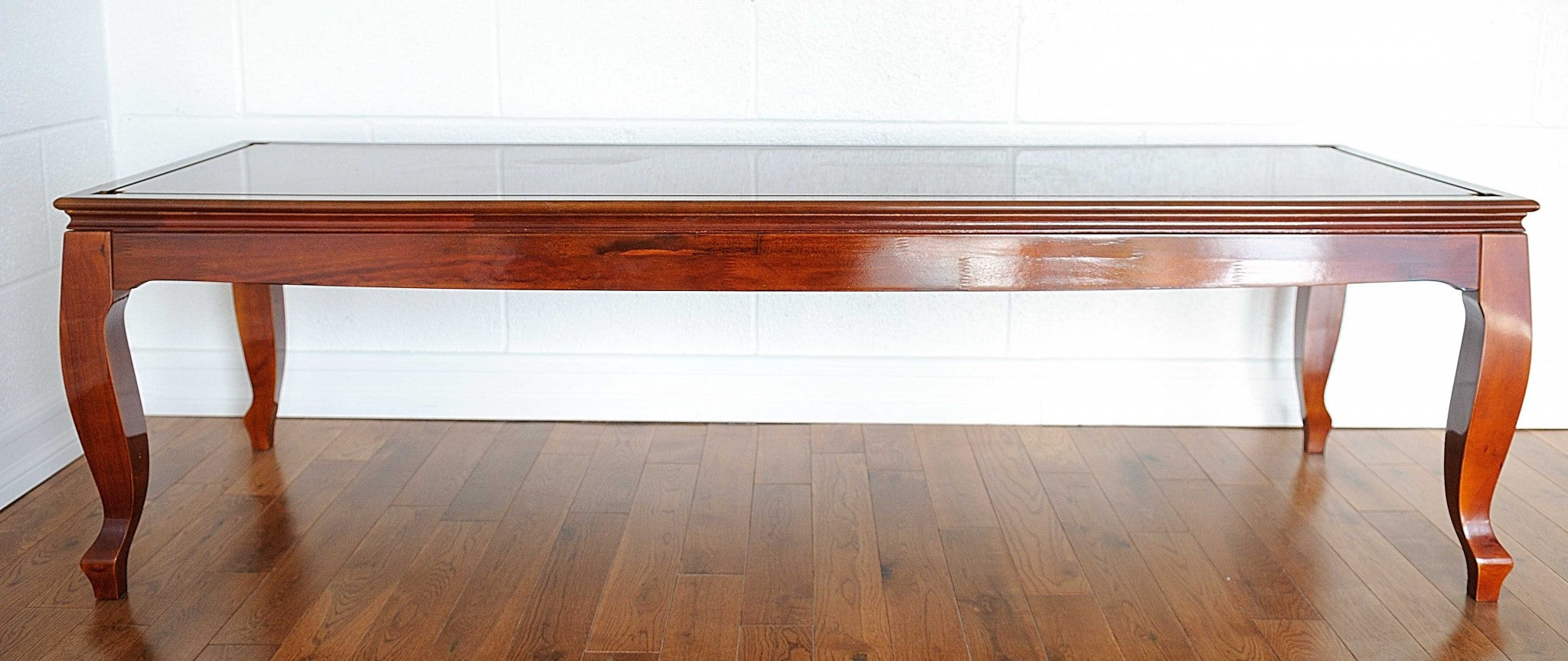 Elegant 23x65x75 inches display case for tall ship models, crafted from hardwood with a dark mahogany finish, showcasing its distinctive design.