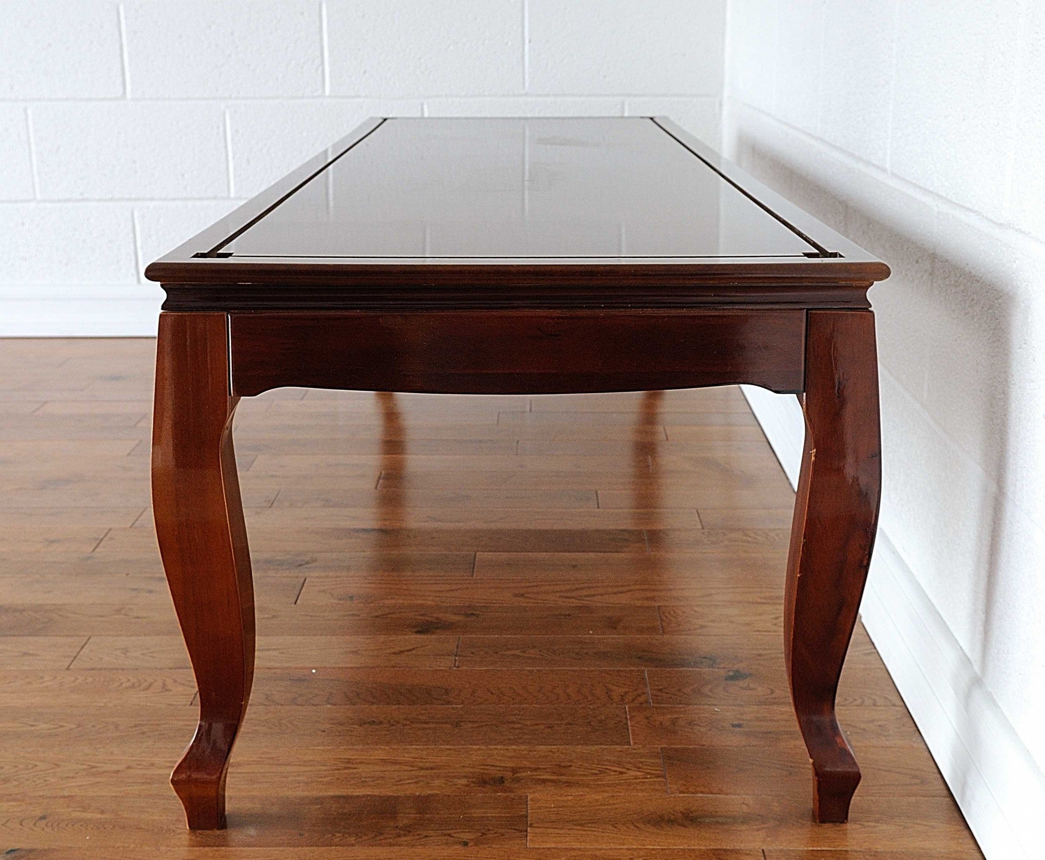 Elegant 23x65x75 inches display case for tall ship models, crafted from hardwood with a dark mahogany finish, showcasing its distinctive design.