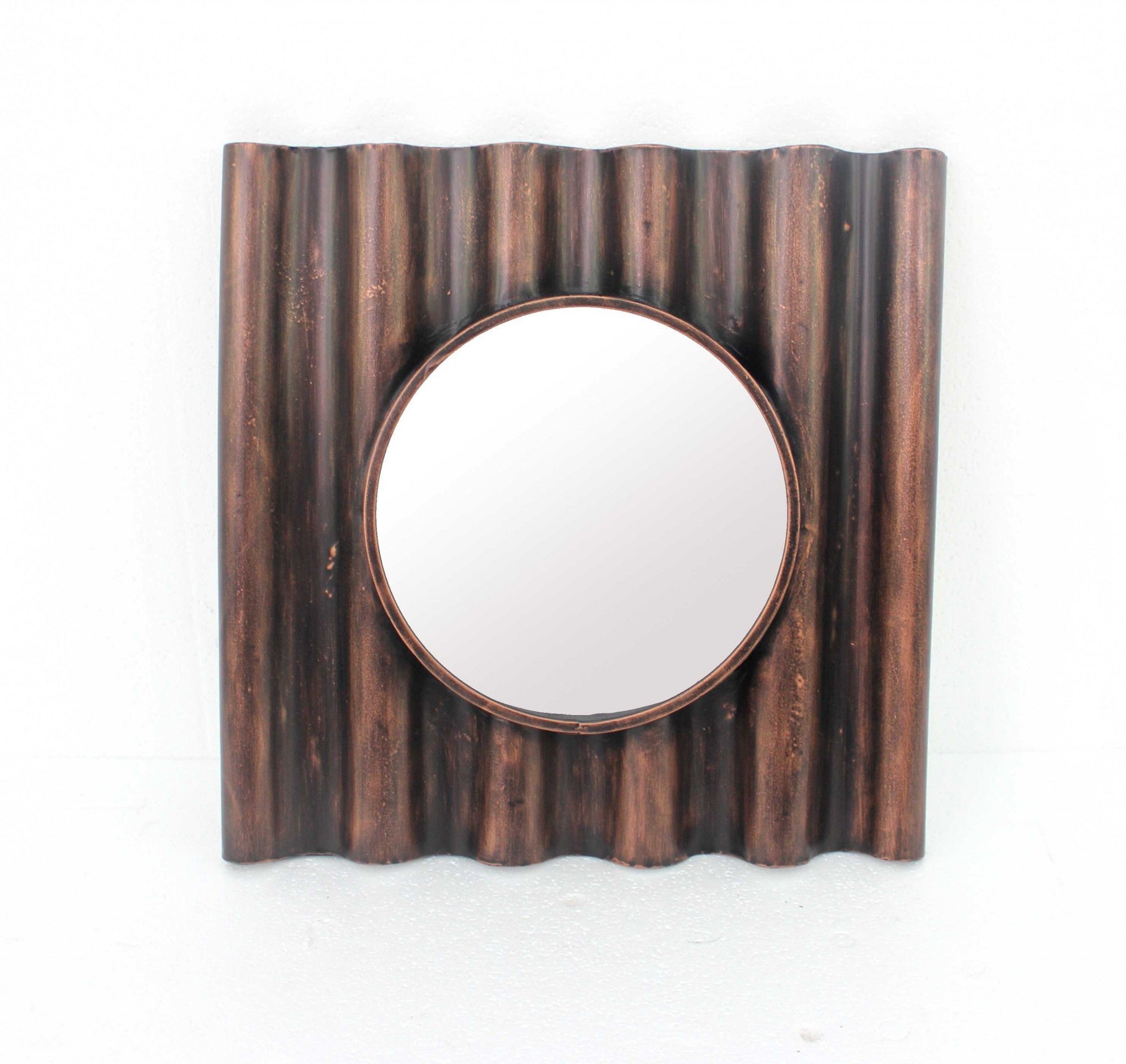 24 x 24 x 3 Bronze Panpipe-Like Wooden Cosmetic Mirror with a vintage mahogany finish and round reflective center.