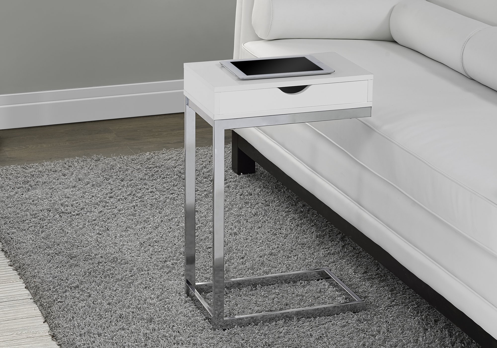 A stylish 24.5-inch white accent table with chromed metal accents, featuring a storage drawer on either side.