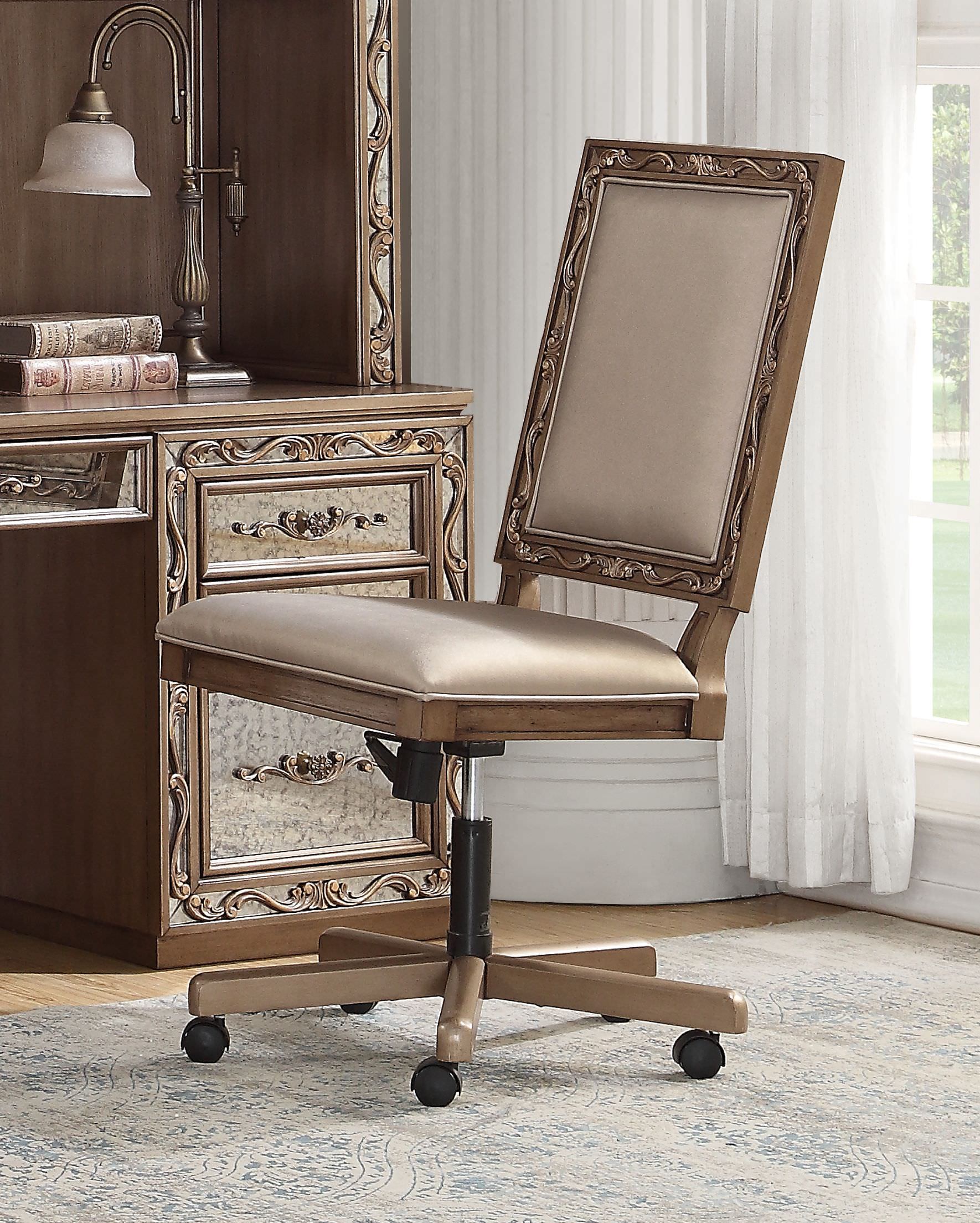 Elegant 24x22x41 inches champagne faux leather upholstered executive office chair with wooden trim and antique gold finish.