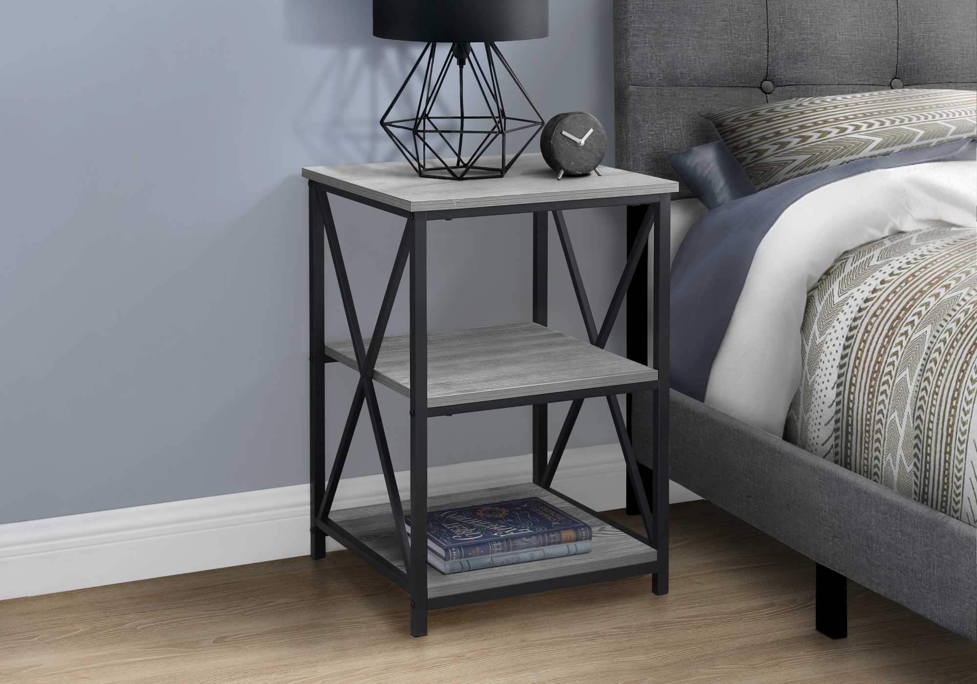 26-inch rectangular grey black metal accent table with X design legs and two open shelves.