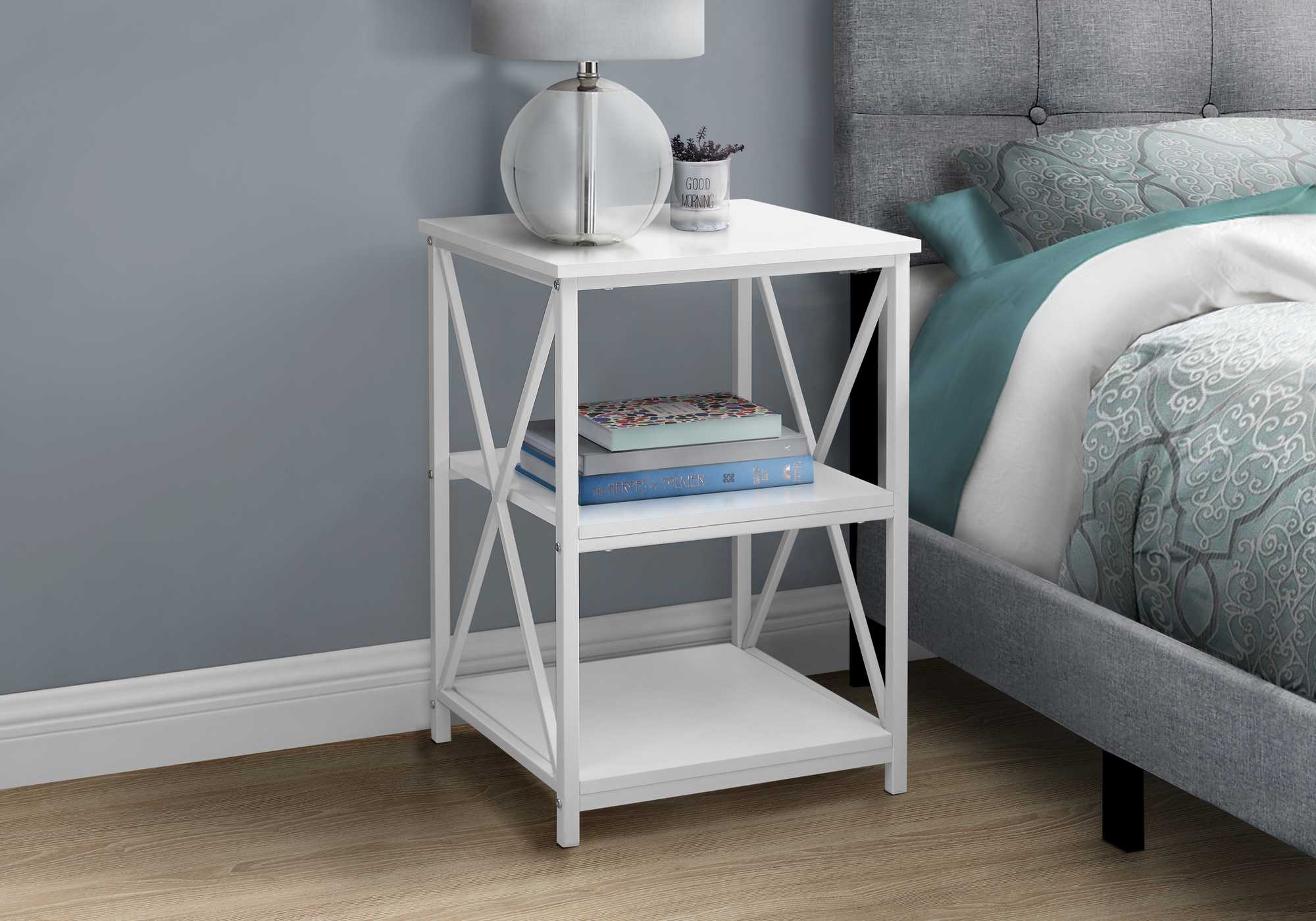 A stylish 26-inch rectangular white metal accent table featuring a chic laminate top and X-design metal legs, perfect for modern decor.