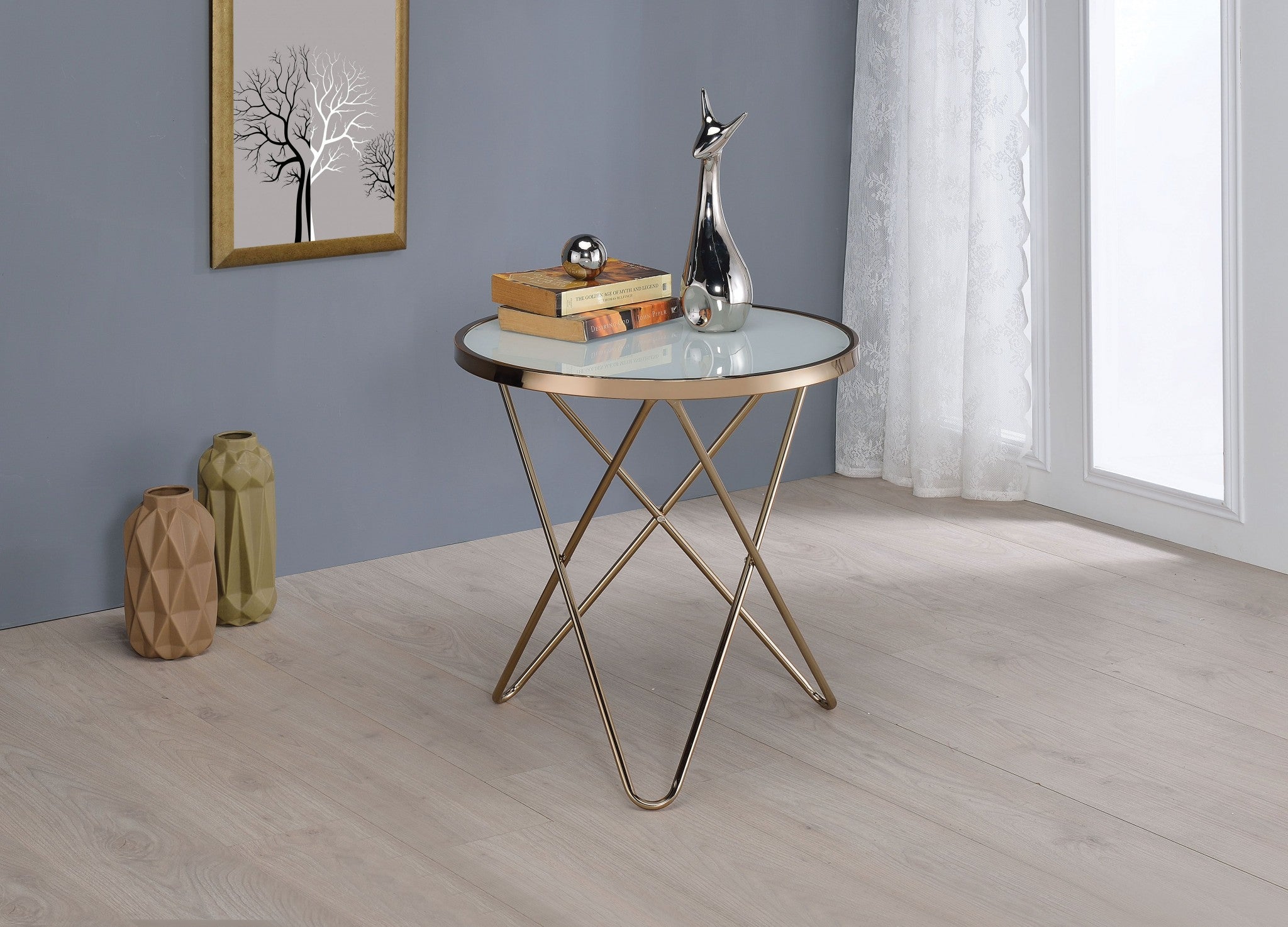 A stylish 22x22 frosted glass end table with champagne metal trim and a V-shape base, perfect for modern living rooms.