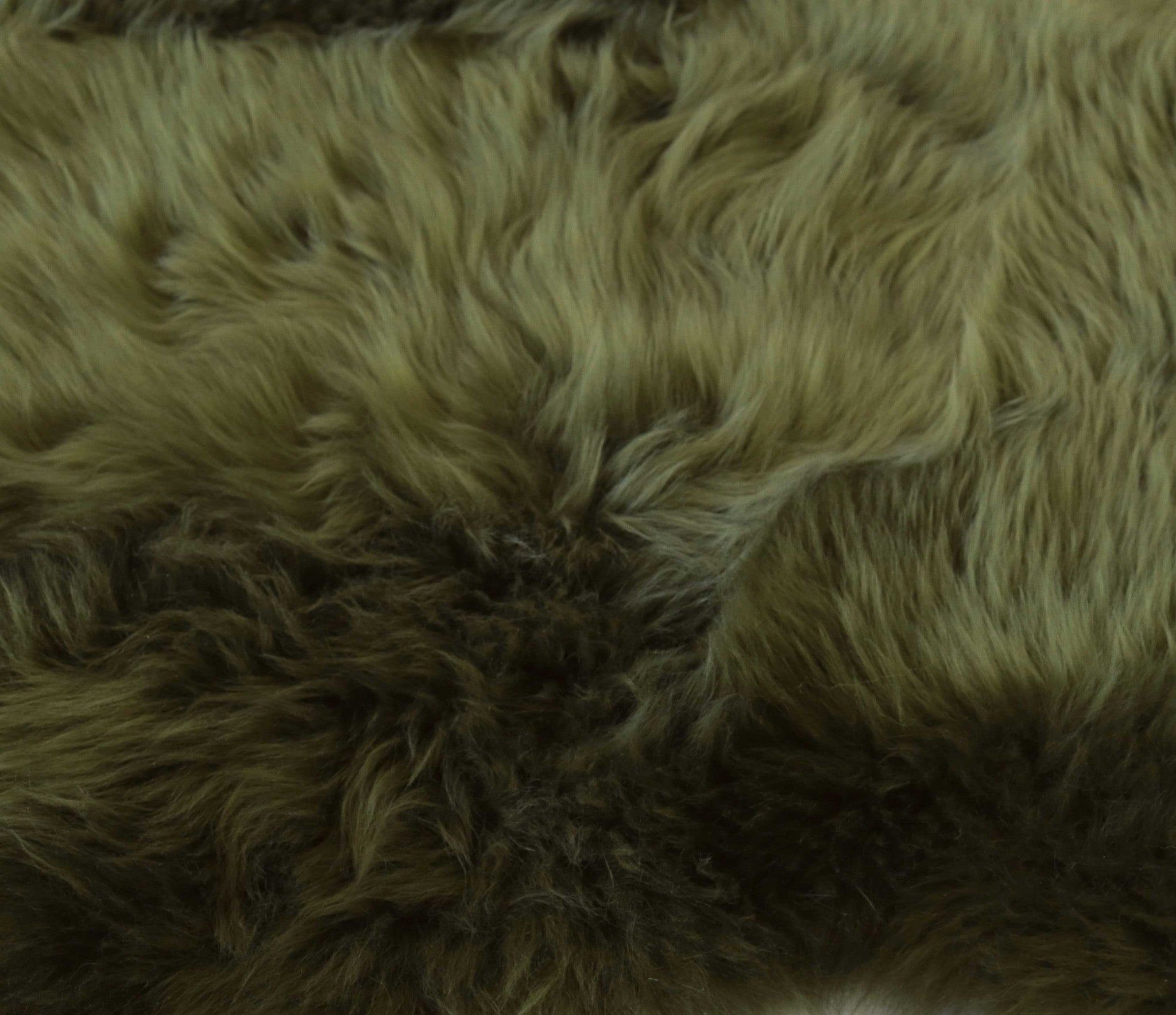 Luxurious 2x3 inches Khaki Green New Zealand Natural Sheepskin Rug with plush texture and anti-skid backing, perfect for home decor.