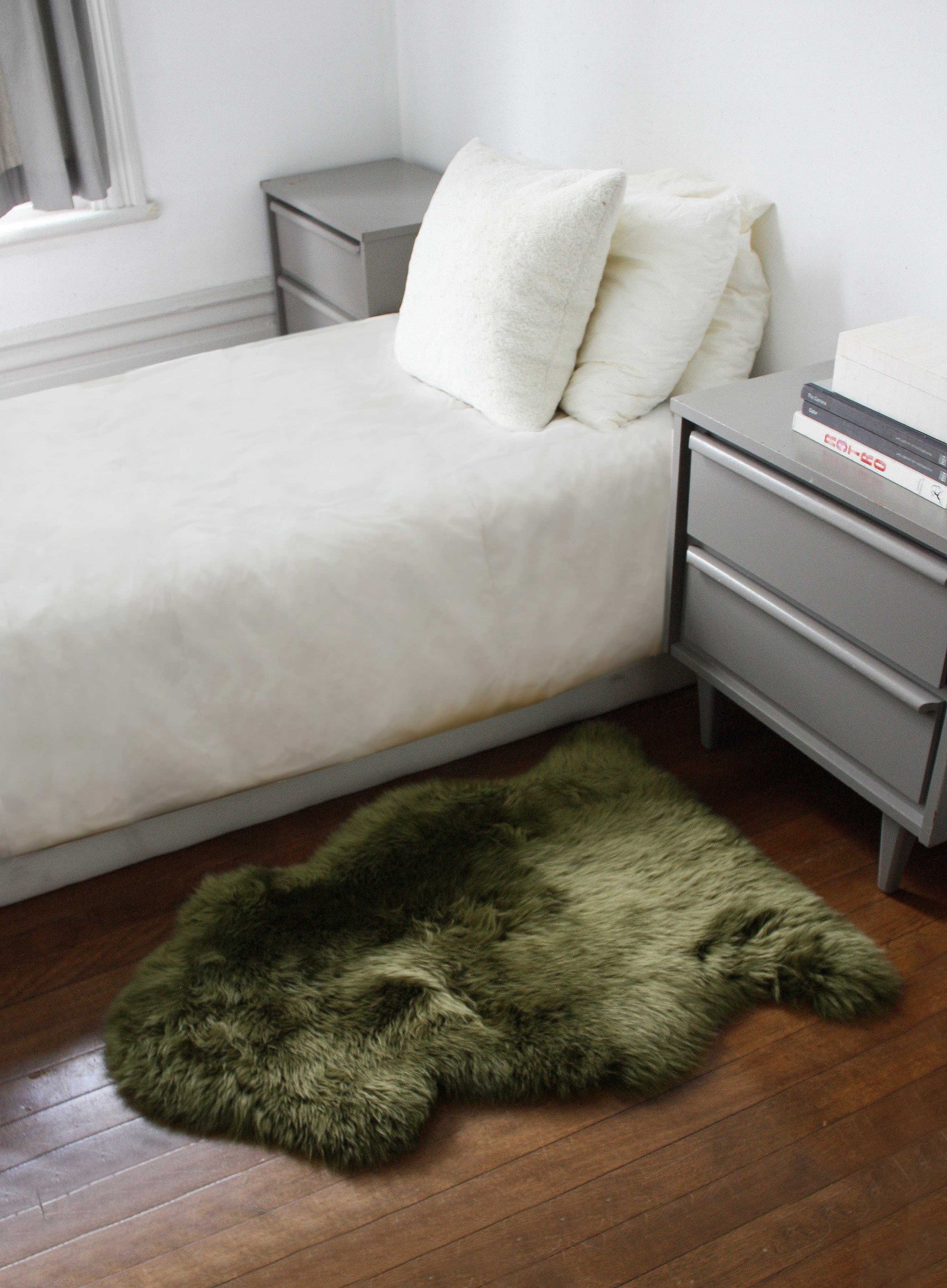 Luxurious 2x3 inches Khaki Green New Zealand Natural Sheepskin Rug with plush texture and anti-skid backing, perfect for home decor.