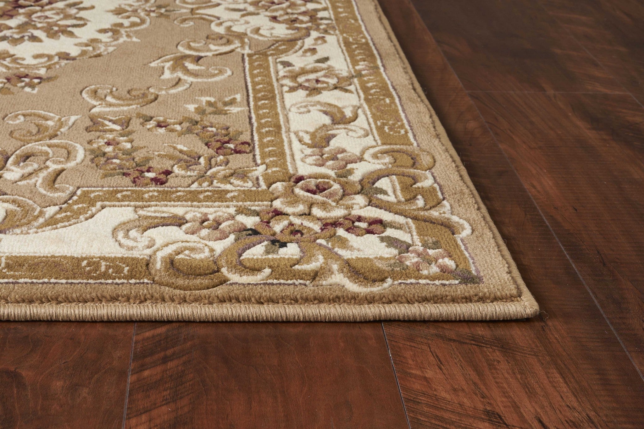 A beautiful 2x3 inches beige or ivory polypropylene accent rug with intricate hand-carved details, perfect for enhancing home decor.