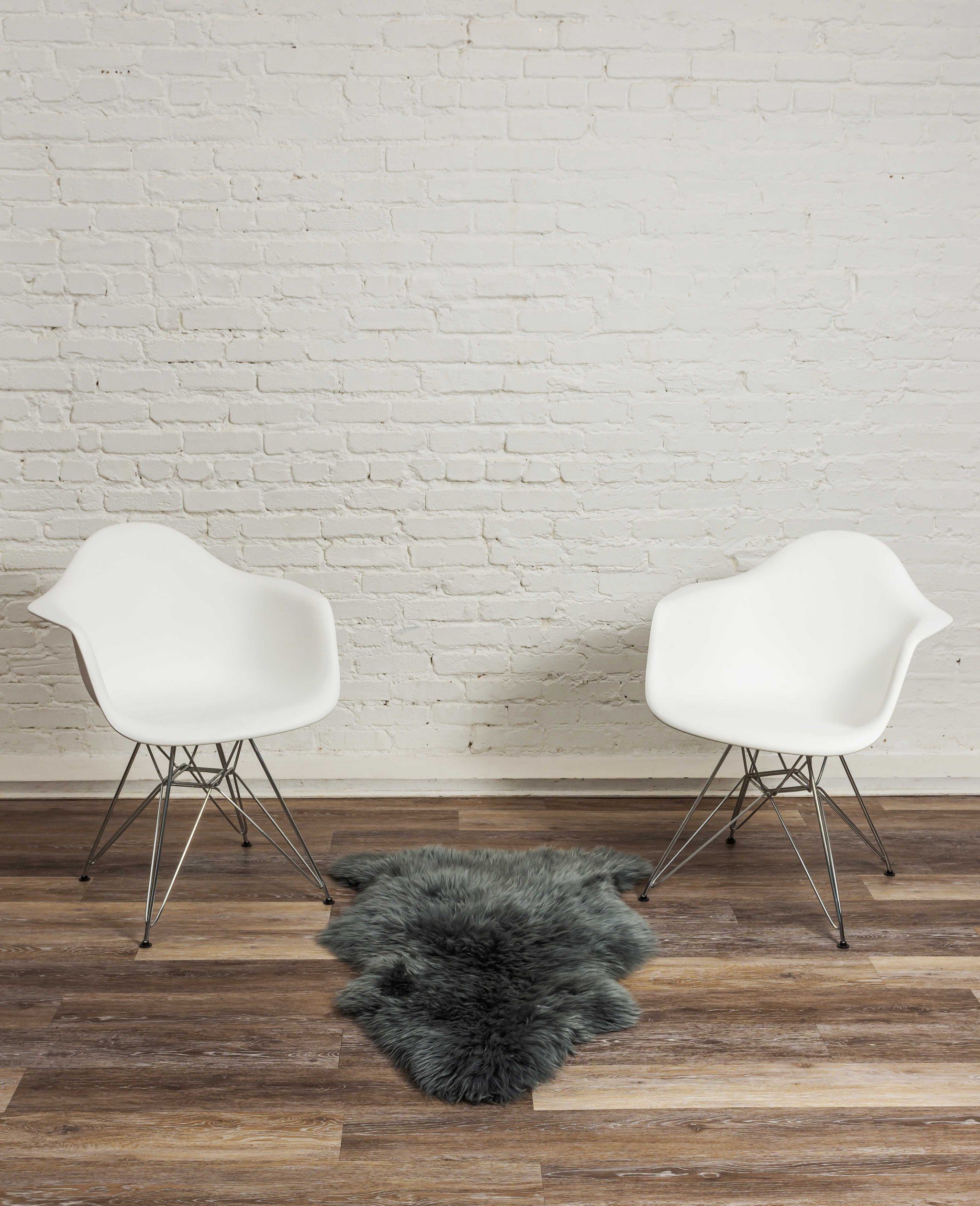 A luxurious 2x3 inches warm gray New Zealand natural sheepskin rug showcasing its soft texture and elegant color, perfect for home decor.