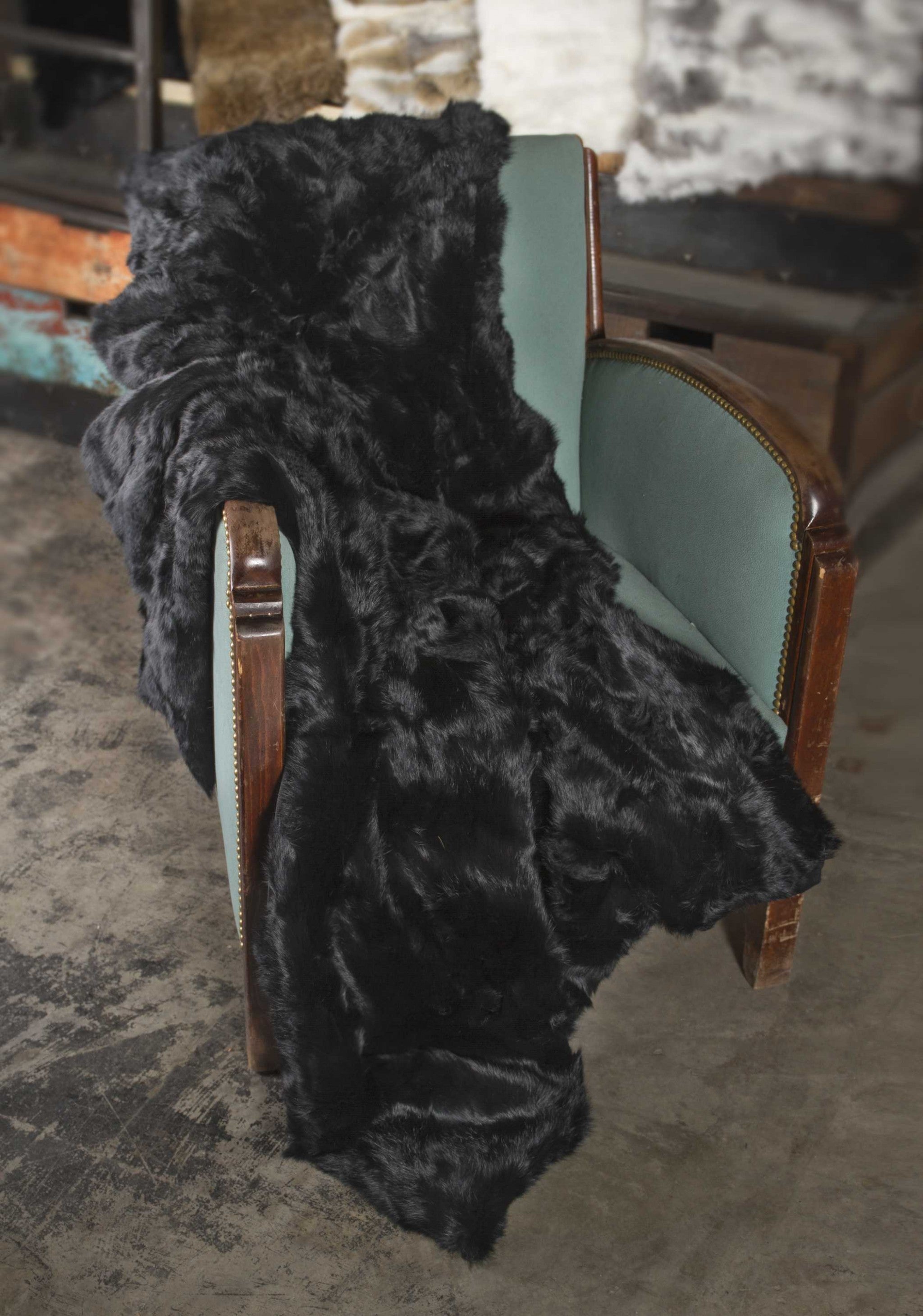Luxurious 100% natural rabbit fur black throw blanket, soft and plush, perfect for home decor.