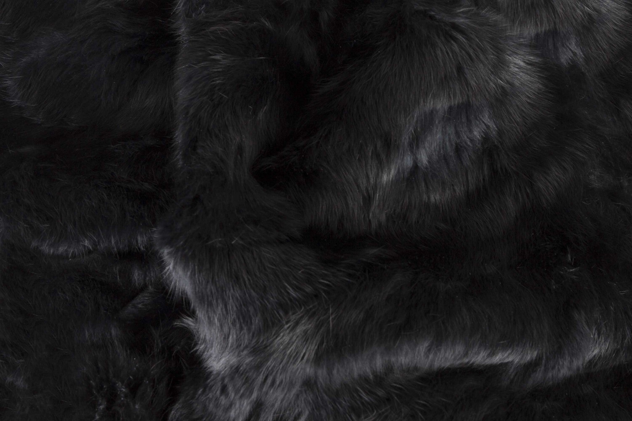 Luxurious 100% natural rabbit fur black throw blanket, soft and plush, perfect for home decor.