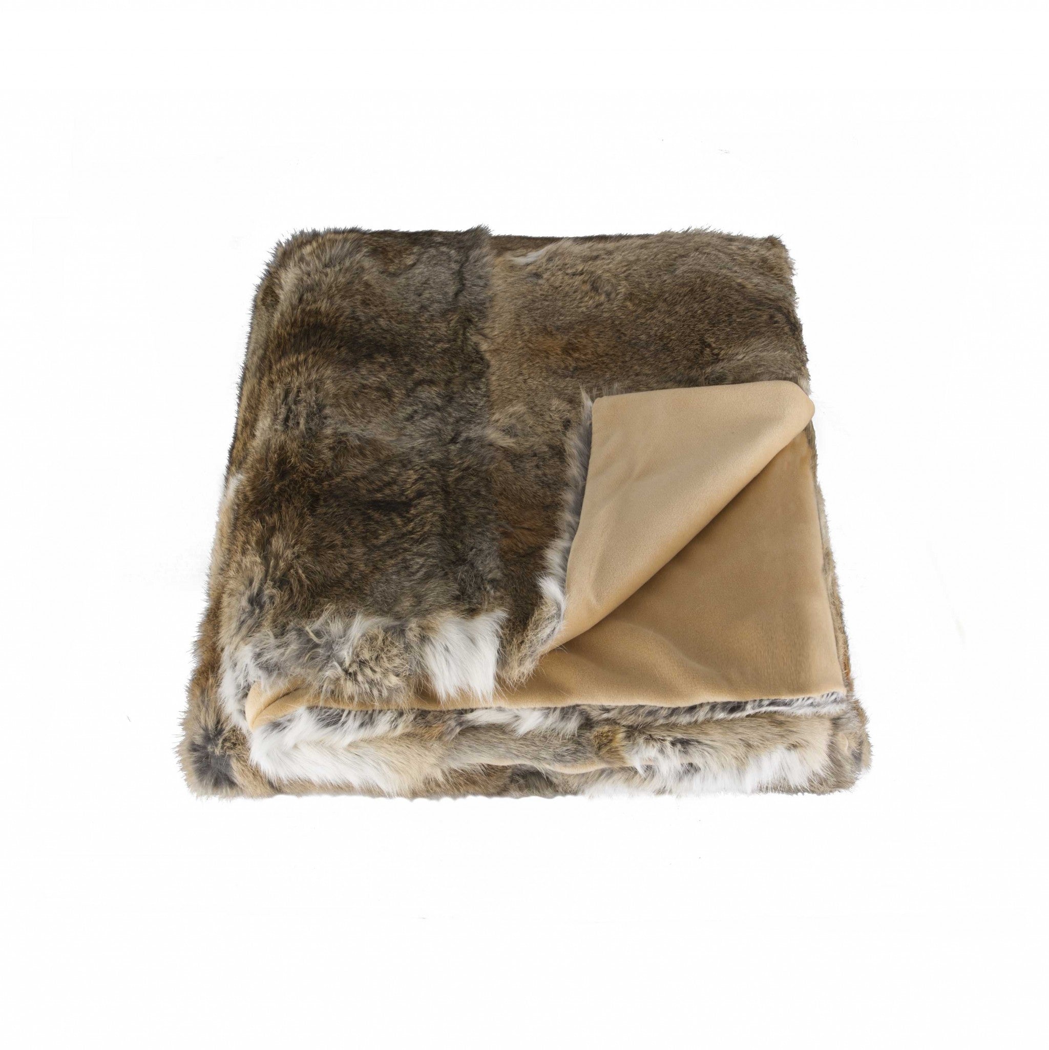 A luxurious 100% natural rabbit fur throw blanket in hazelnut color, showcasing its plush texture and elegant design.