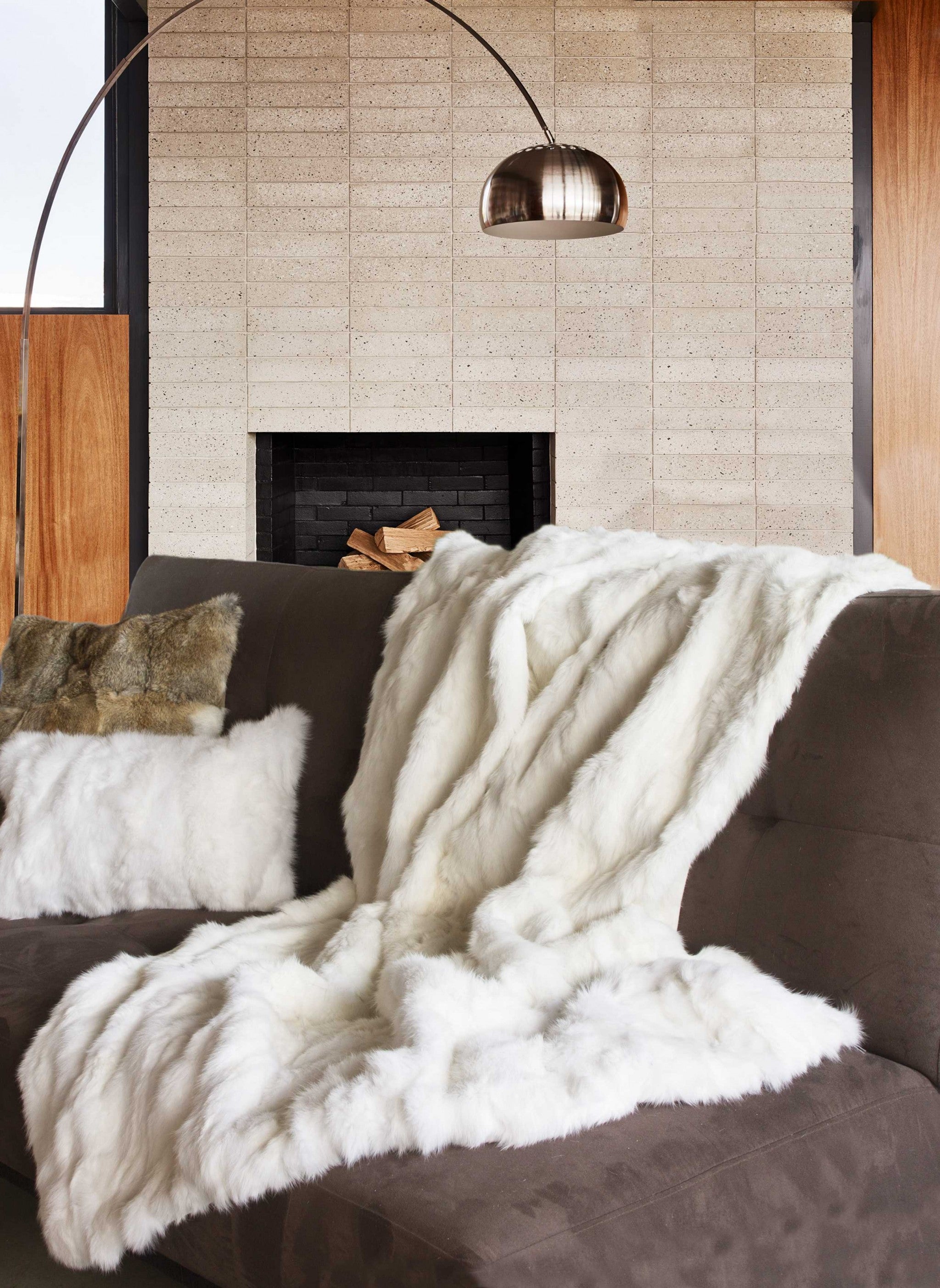 A luxurious 100% natural rabbit fur white throw blanket, showcasing its soft texture and elegant design, perfect for home decor.