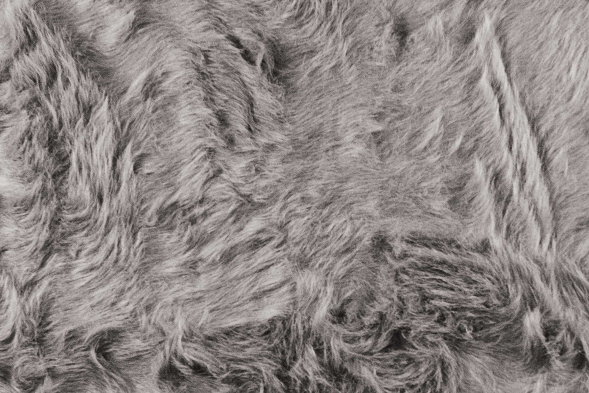 A luxurious 2inches x 6inches gray faux sheepskin double area rug with a soft plush texture, perfect for enhancing home decor.