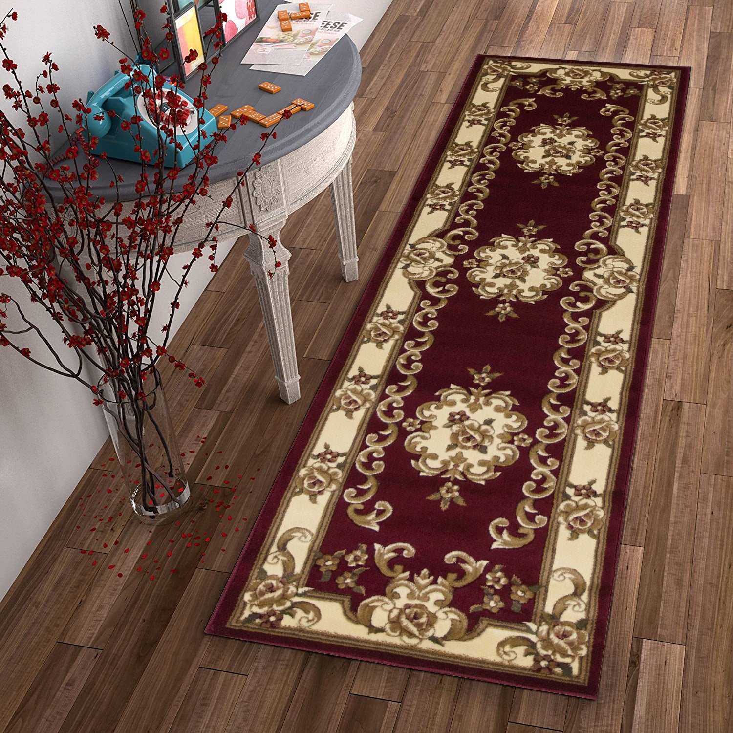 A beautiful 2x8 red and ivory medallion runner rug, showcasing intricate patterns and a vibrant color scheme, perfect for enhancing home decor.