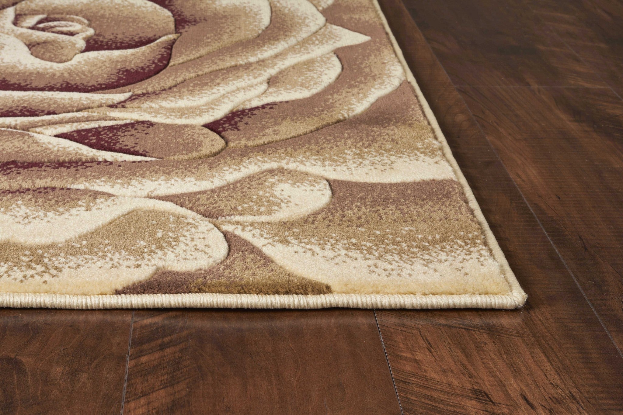 Ivory oversized floral rug, machine woven and hand carved, showcasing intricate floral patterns and a soft texture.