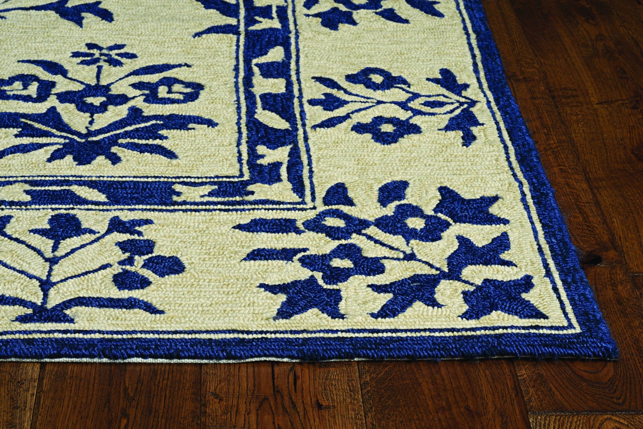 A 2x3 sand blue hand hooked floral rug, showcasing intricate designs suitable for indoor and outdoor use.