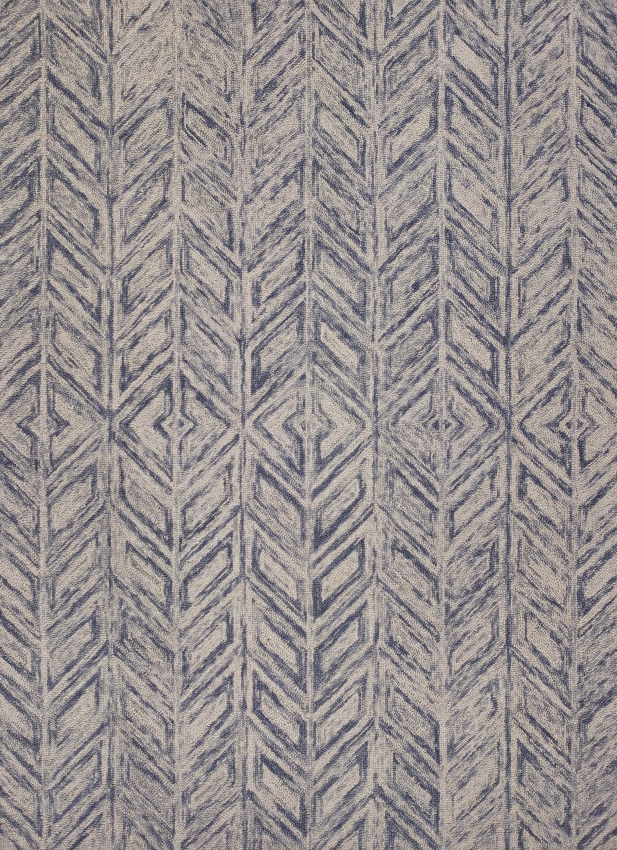 A beautiful blue hand tufted herringbone indoor accent rug, showcasing a modern design and high-quality wool material.