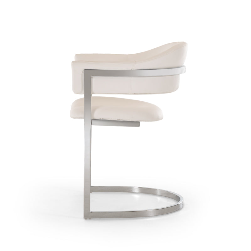 30-inch white leatherette dining chair with stainless steel legs, showcasing a modern and elegant design suitable for dining rooms.