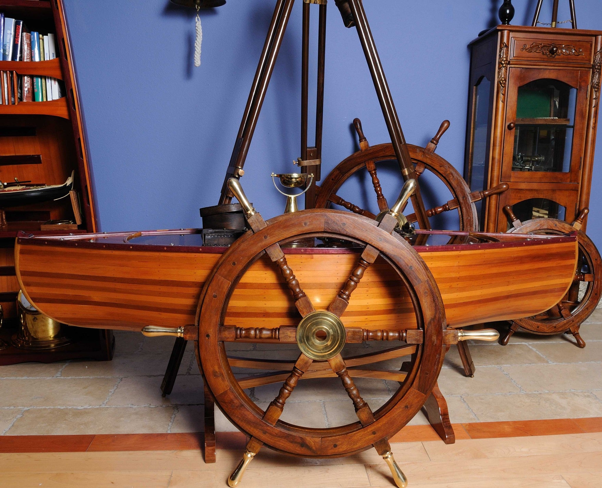 A beautifully crafted 30-inch ship wheel made from rosewood with a brass hub and handles, showcasing a shiny natural finish.