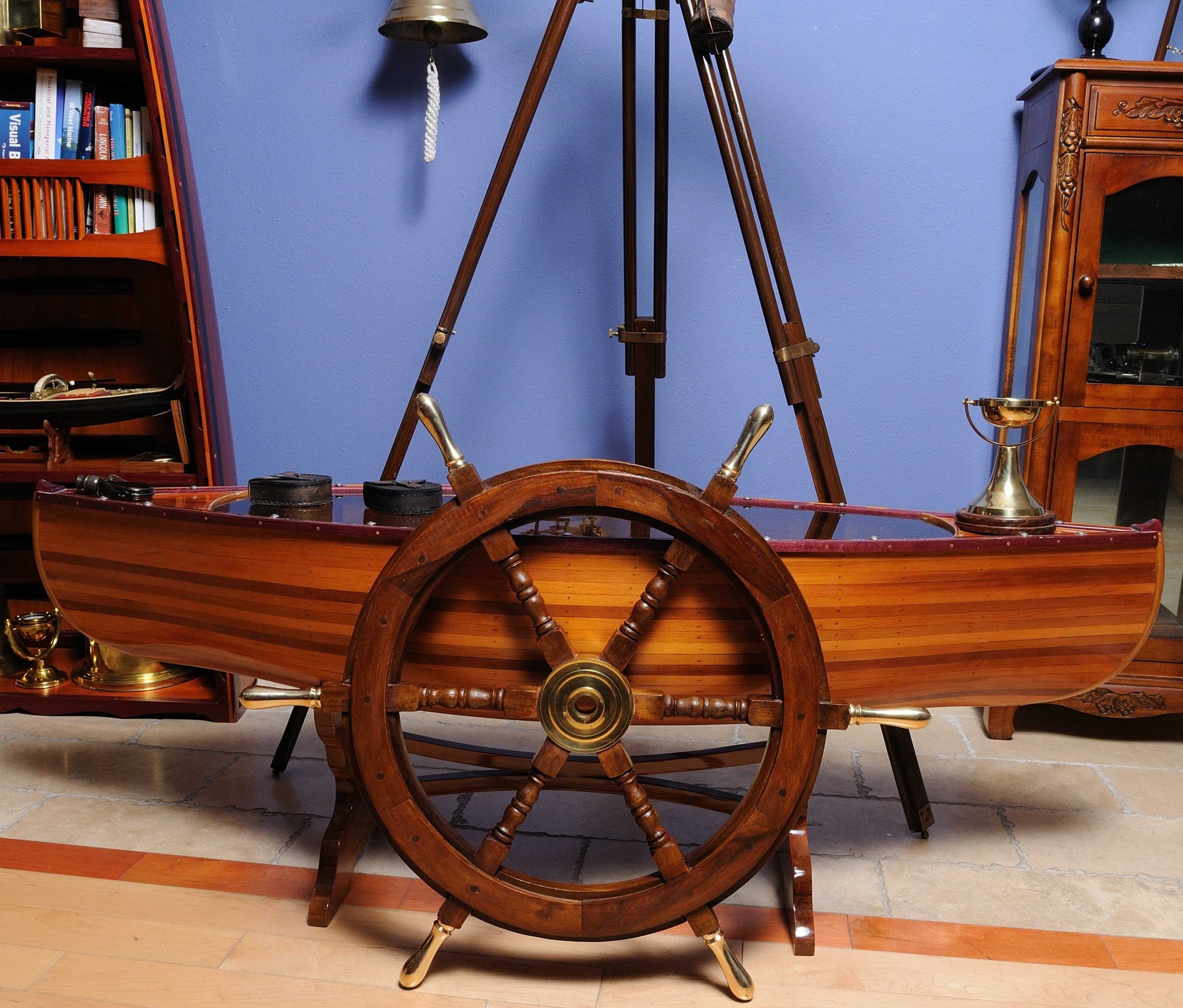 A beautifully crafted 30-inch ship wheel made from rosewood with a brass hub and handles, showcasing a shiny natural finish.