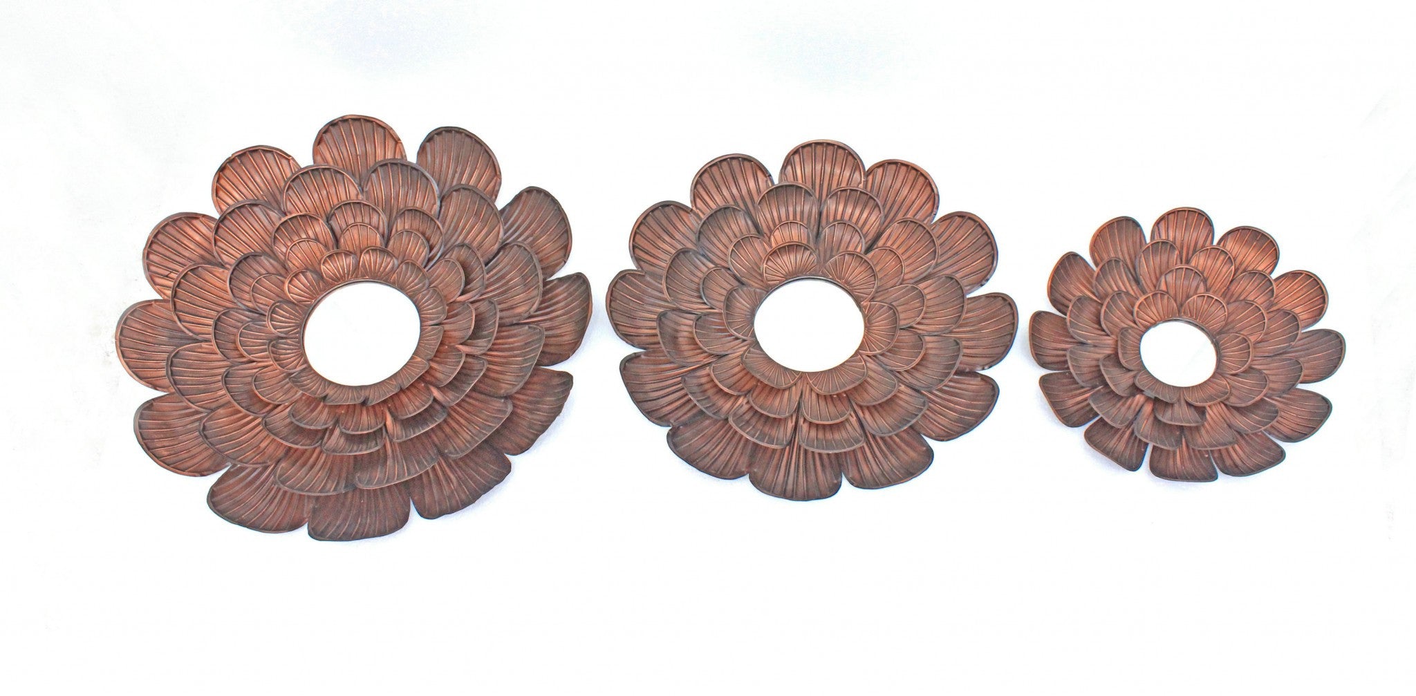A stunning 31 x 31 x 3.5 Copper Vintage Blooming Flower Metal Wall Mirror featuring a unique flower shape and antiqued copper finish, perfect for home decor.